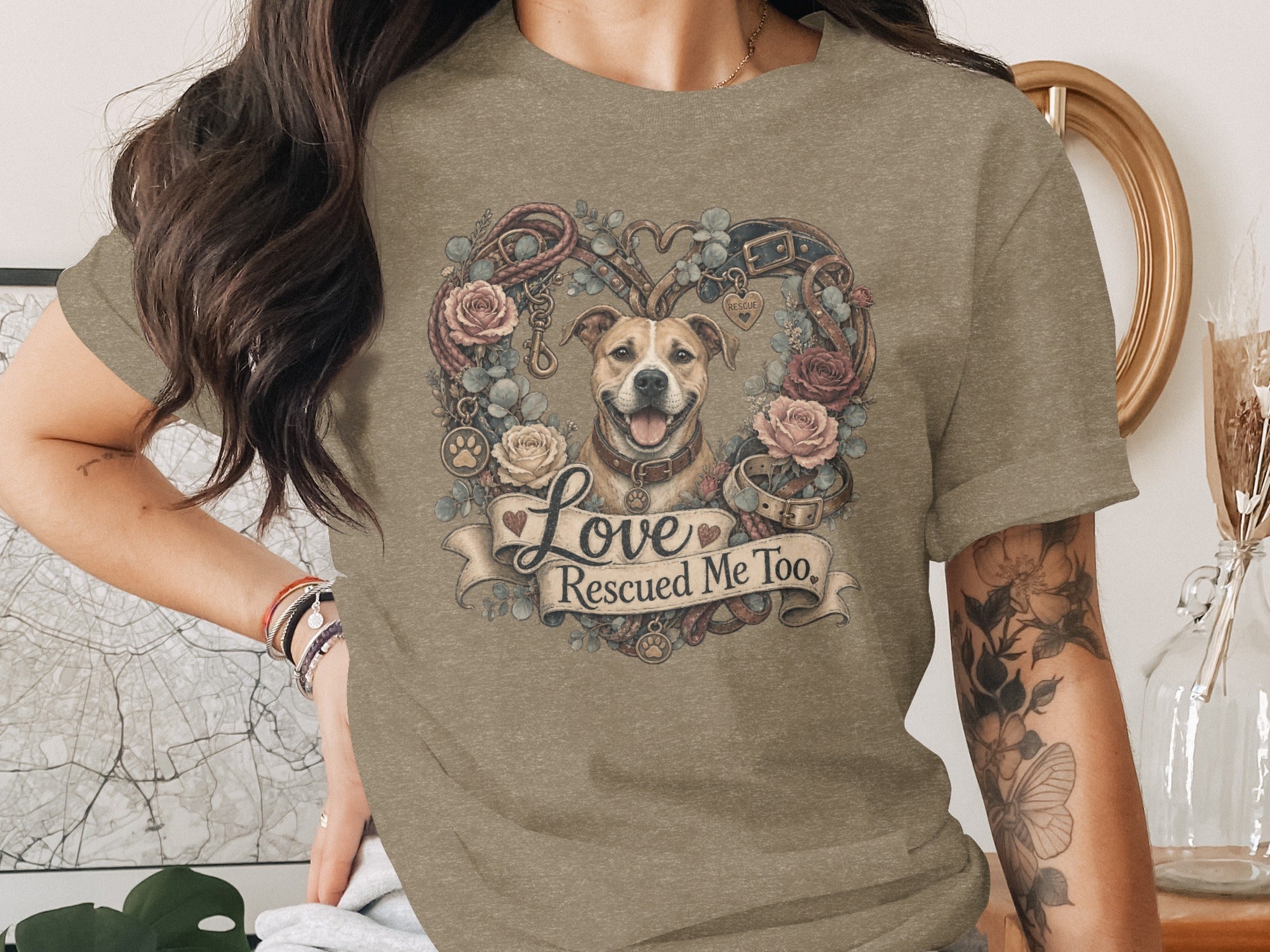 T-shirt with a dog surrounded by flowers, ropes, and the text "Love Rescued Me Too."