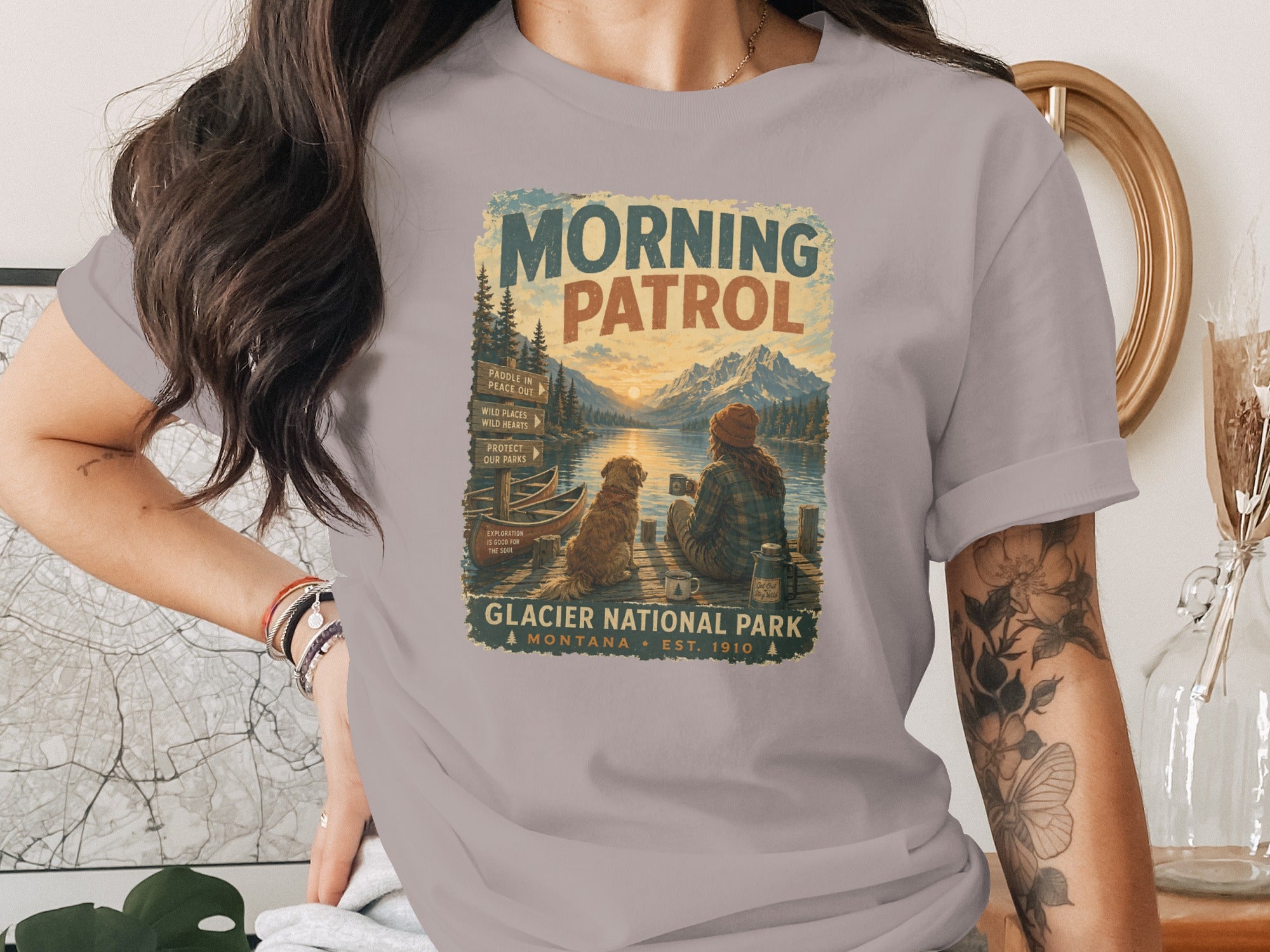 Glacier National Park graphic on a t-shirt with "Morning Patrol" and mountain landscape.