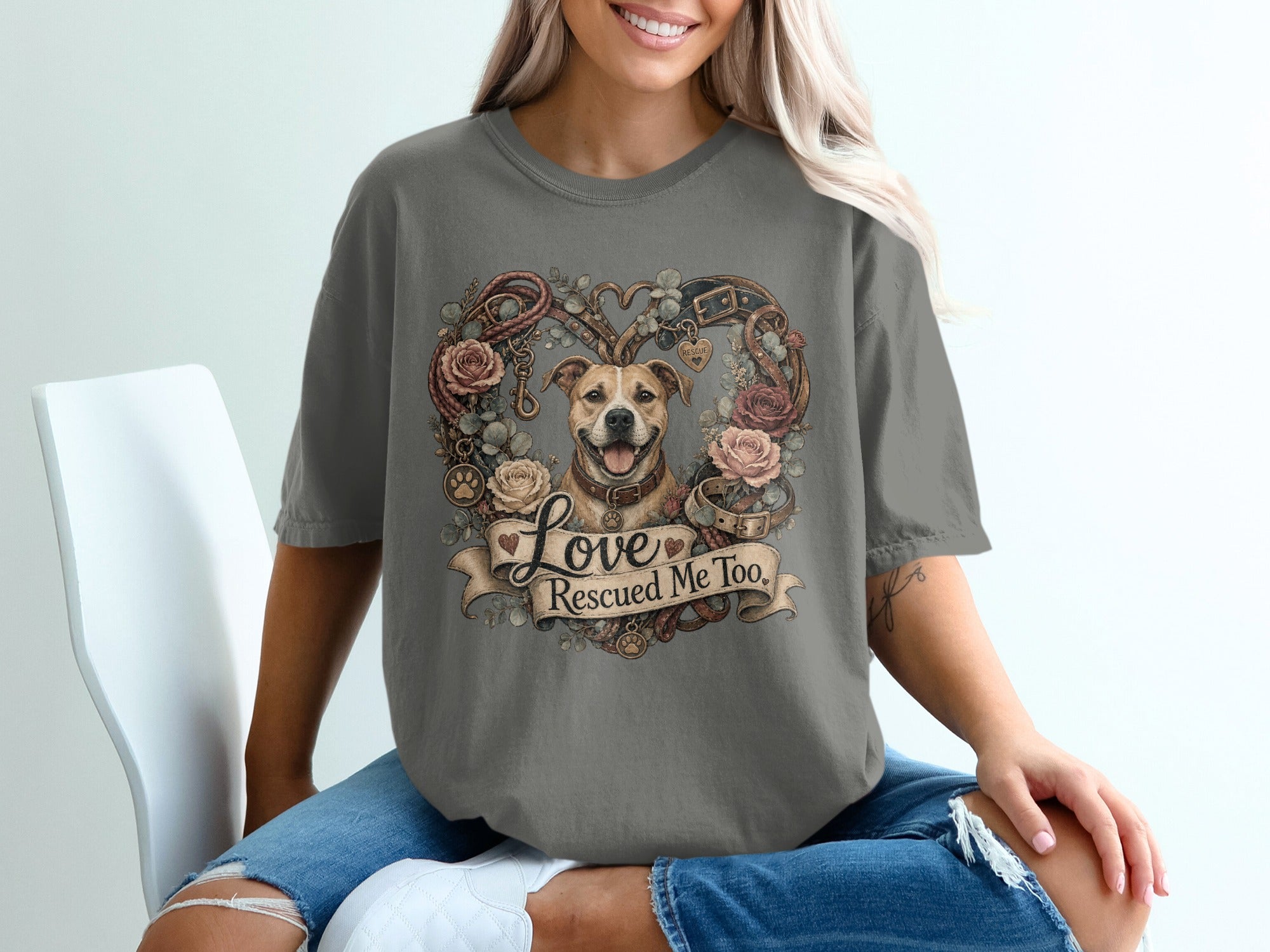 Dog centered within heart shaped wreath of roses, leashes, and collars with text "Love Rescued Me Too."