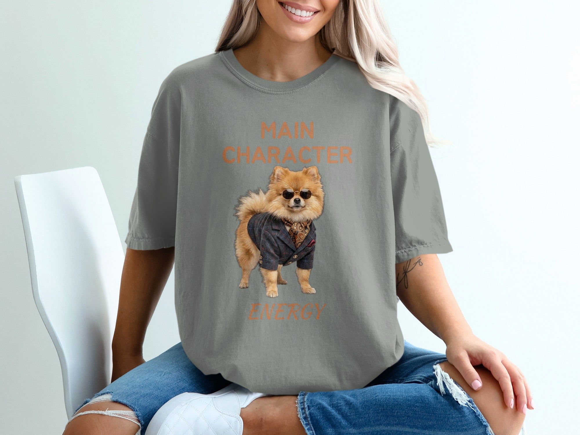 Grey t-shirt with "Main Character Energy" text and a dog in a suit.