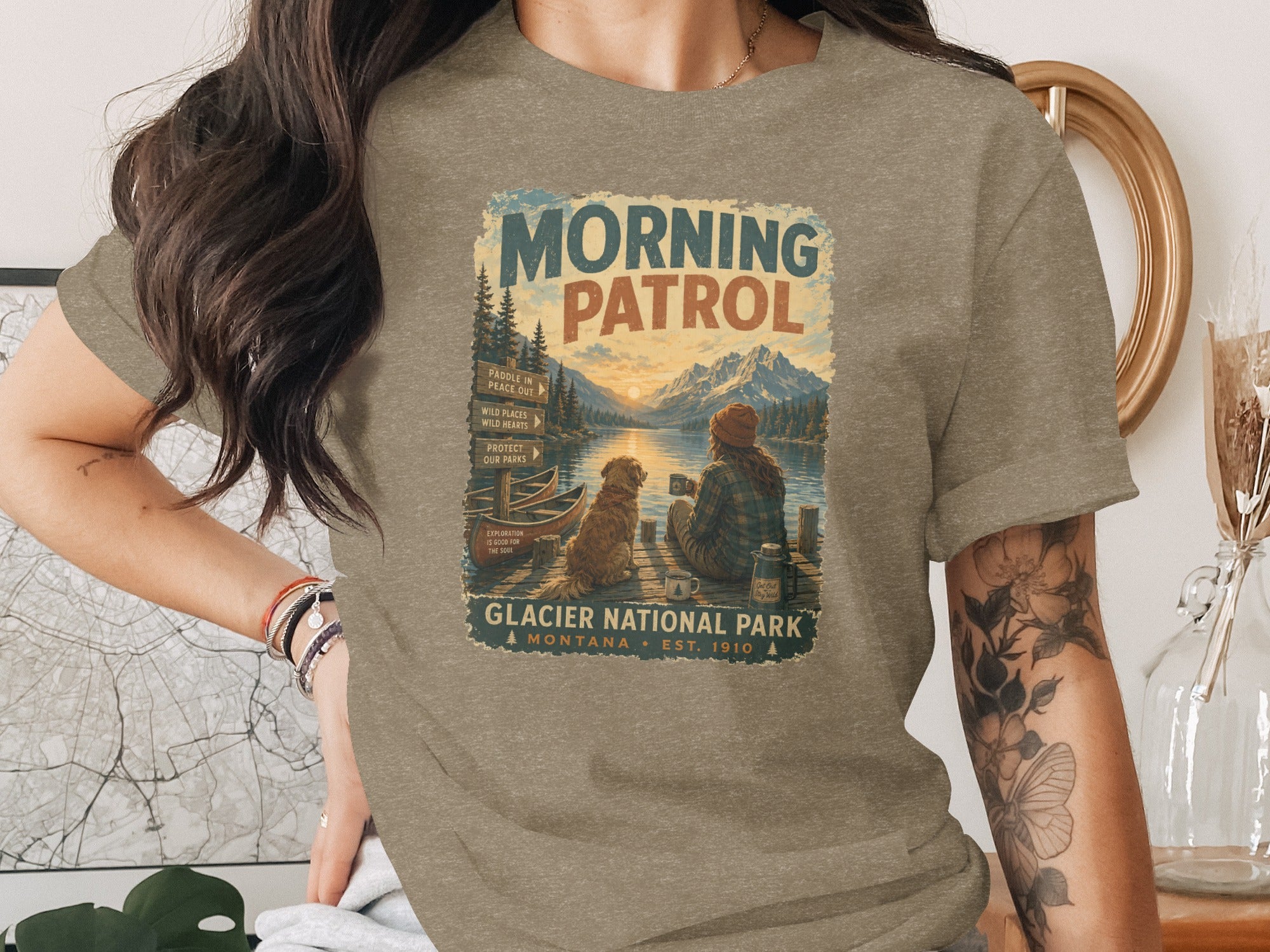 Glacier National Park "Morning Patrol" graphic tee featuring a person and dog by a lake.