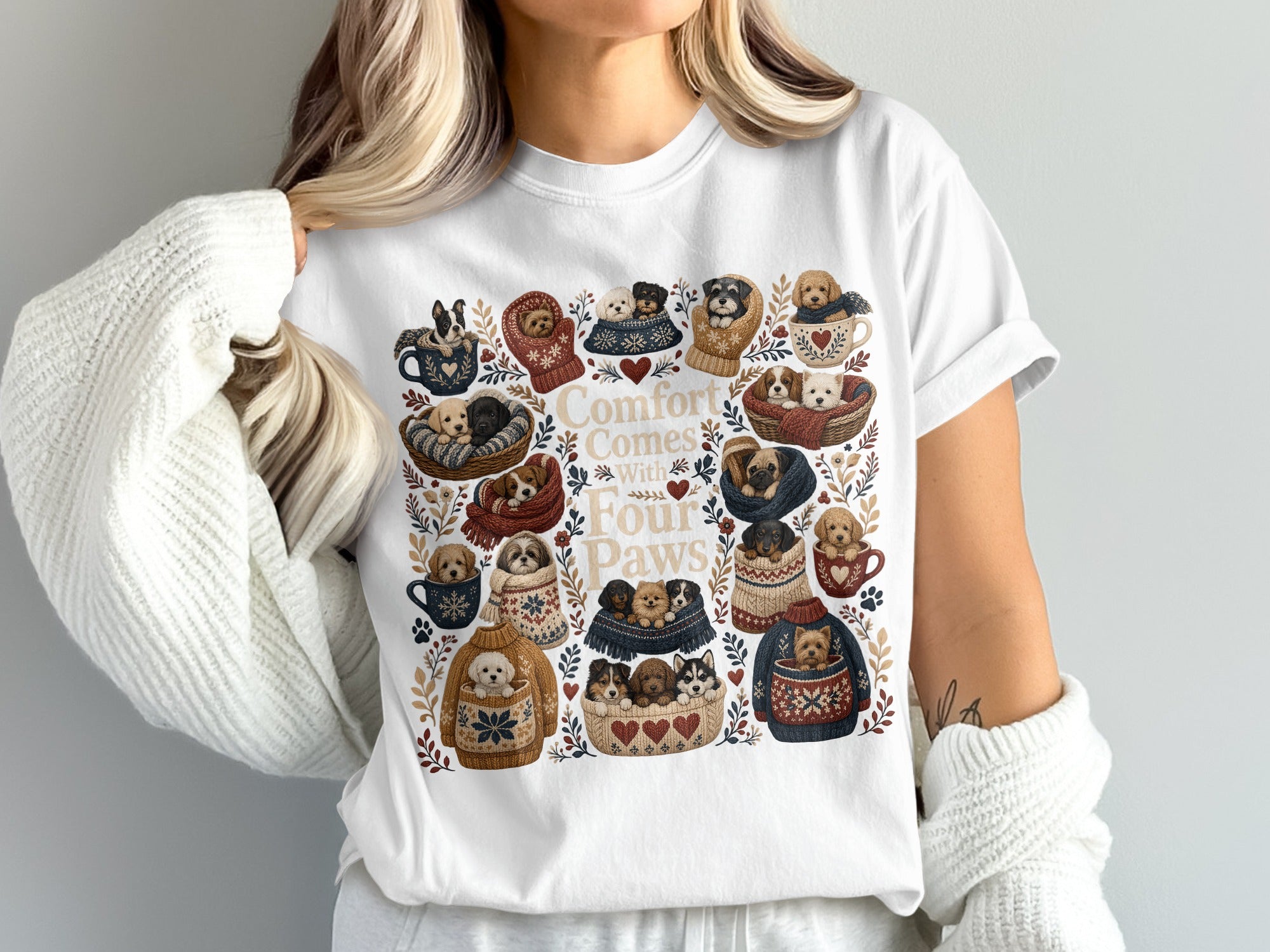 T-shirt graphic "Comfort Comes With Four Paws" featuring cozy puppies in mugs and sweaters.