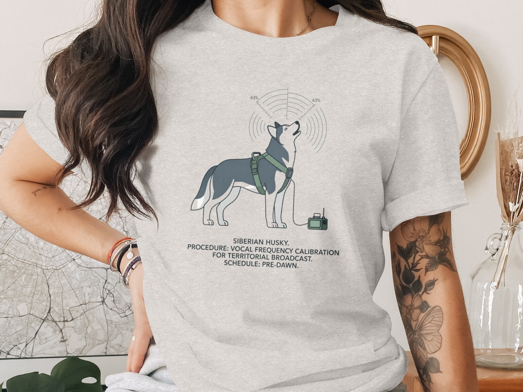 Grey t-shirt with illustration of Siberian Husky, radio equipment and text.