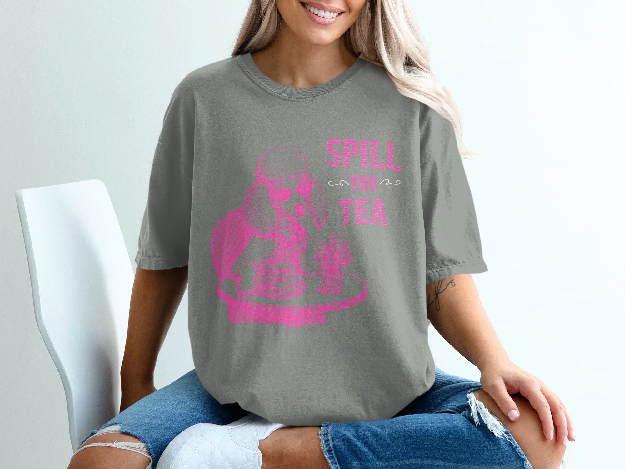 Grey t-shirt with pink poodle graphic and "Spill the Tea" text.