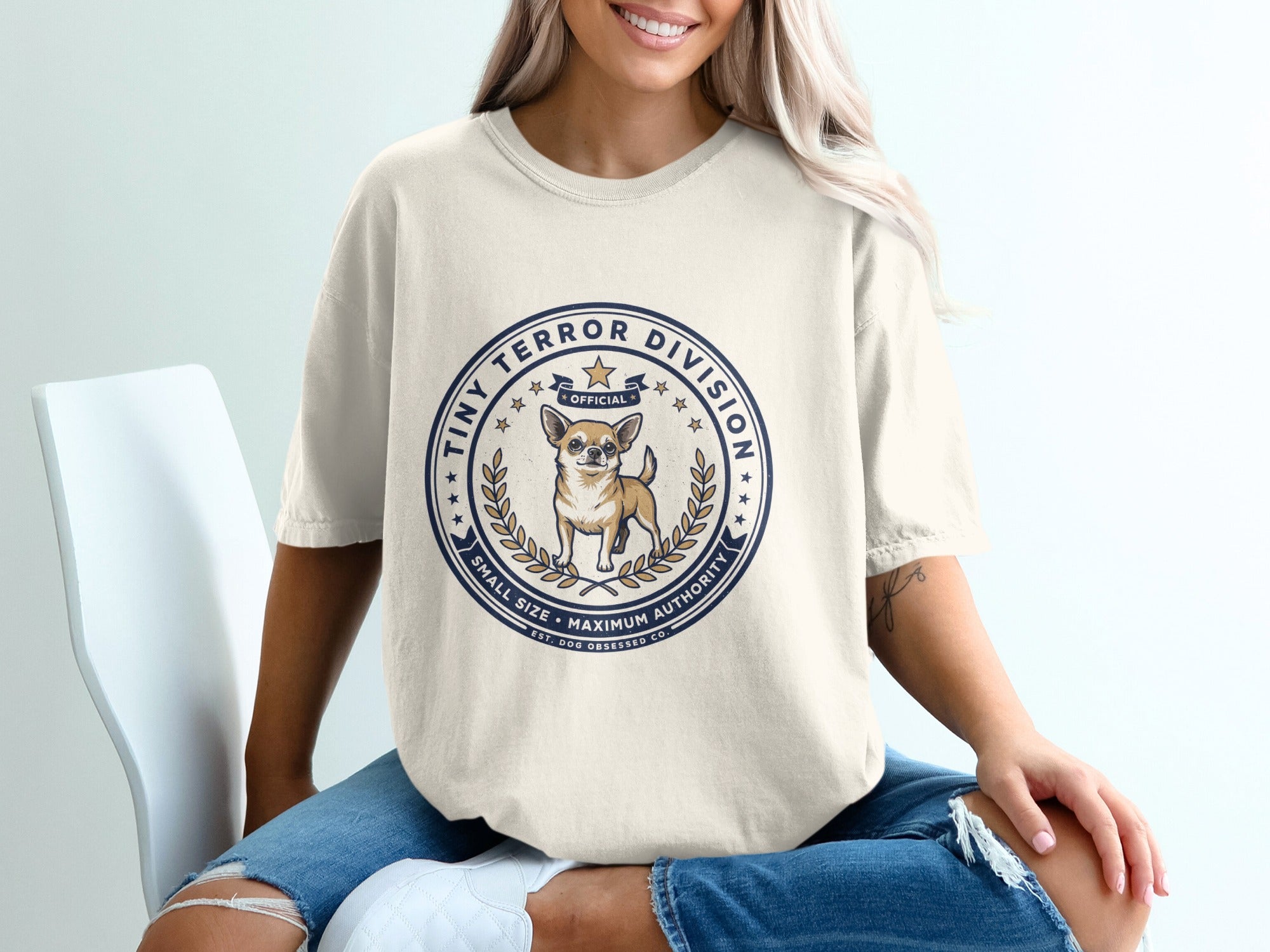 Cream t-shirt with "Tiny Terror Division Official" and chihuahua graphic.