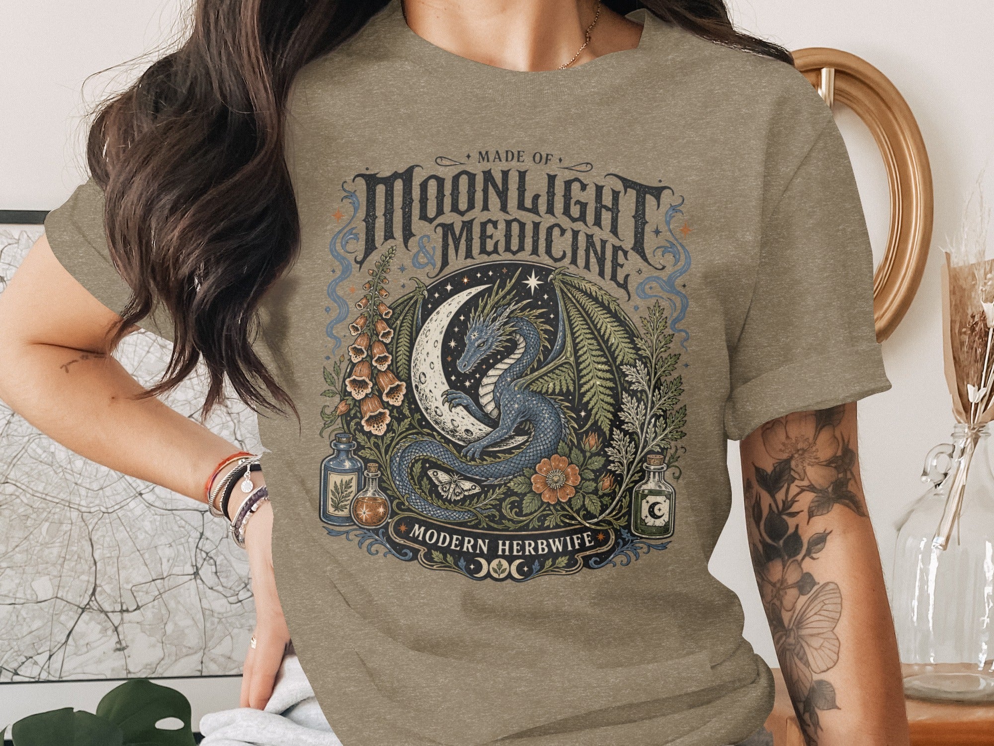 Crewneck t-shirt with "Made of Moonlight & Medicine" and a dragon and moon design.