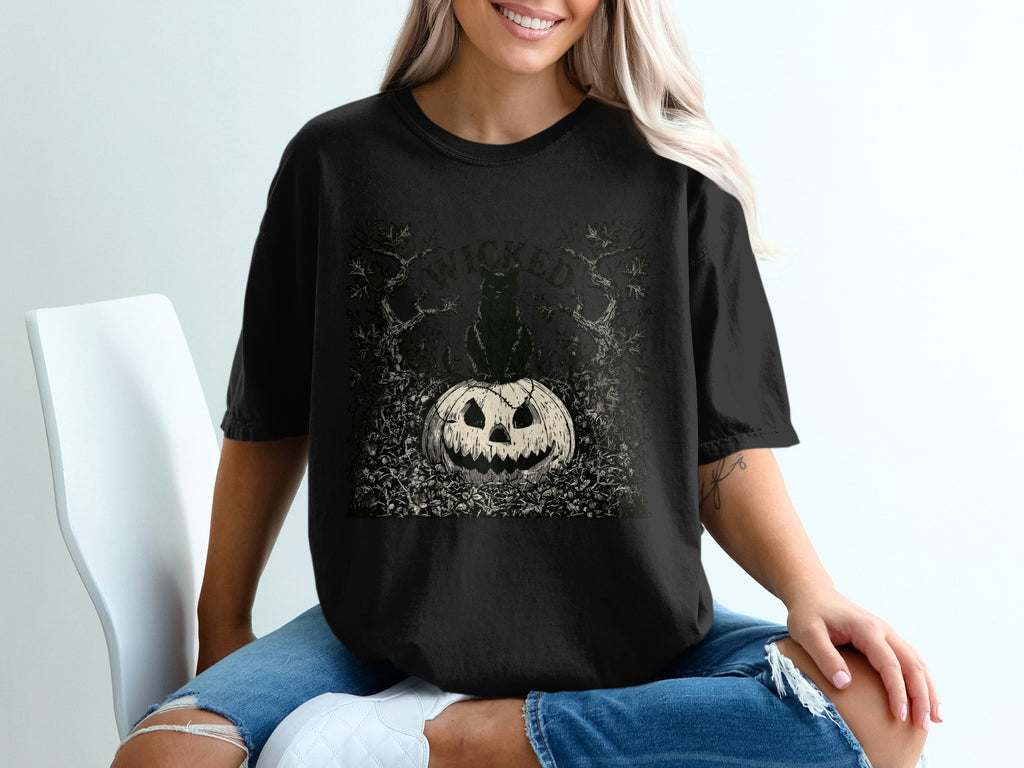 Black t-shirt with a distressed "wicked" graphic featuring a black cat and jack-o-lantern.