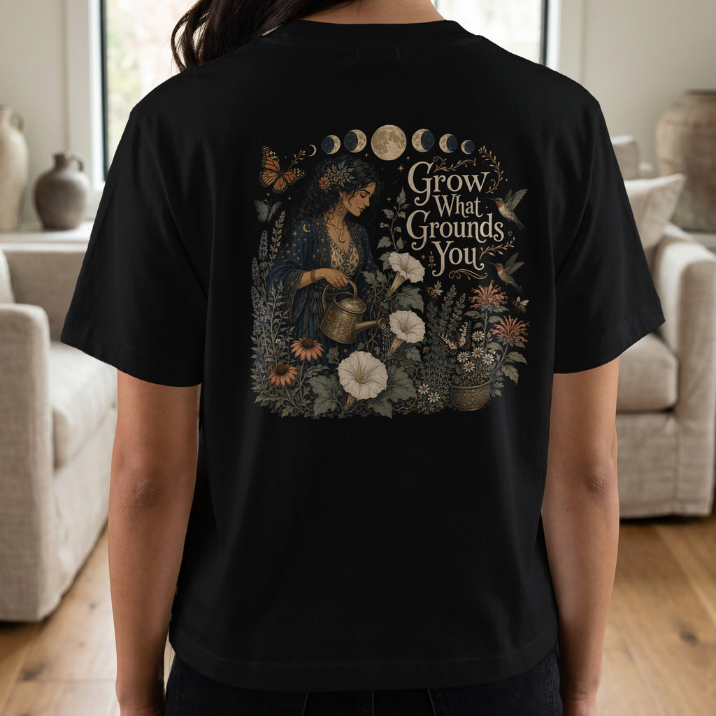 Black t-shirt with gothic floral illustration and "Grow What Grounds You" text.