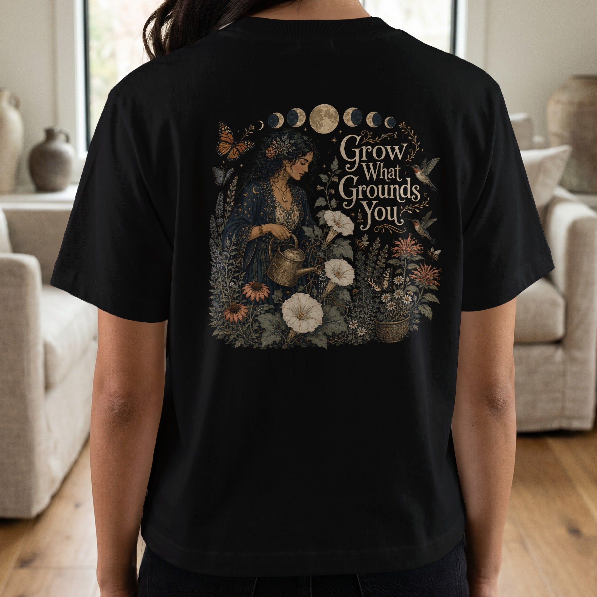 Black t-shirt with gothic floral illustration and "Grow What Grounds You" text.