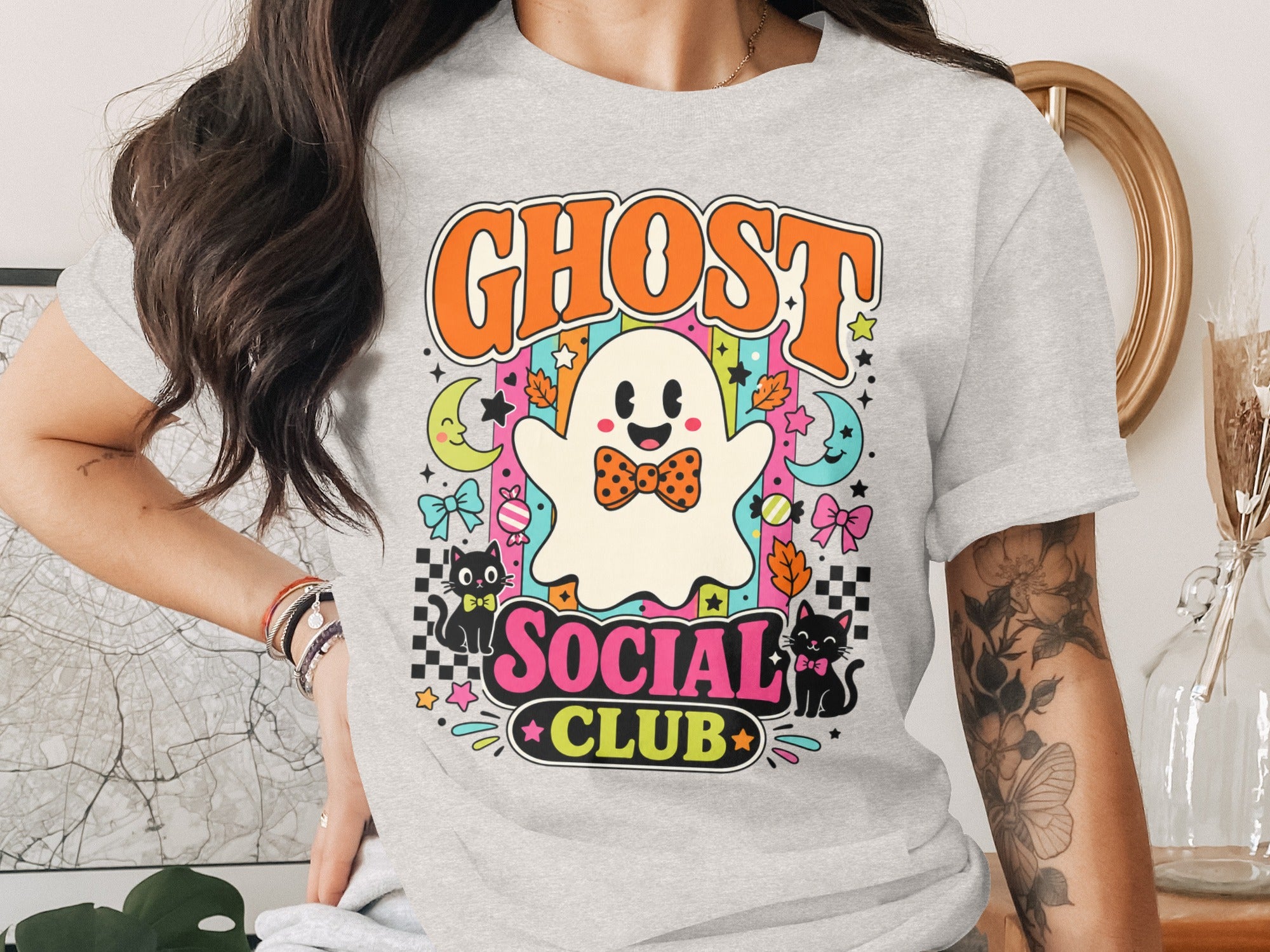 "Ghost Social Club" graphic with a retro ghost, cats, moons, and colorful stripes.