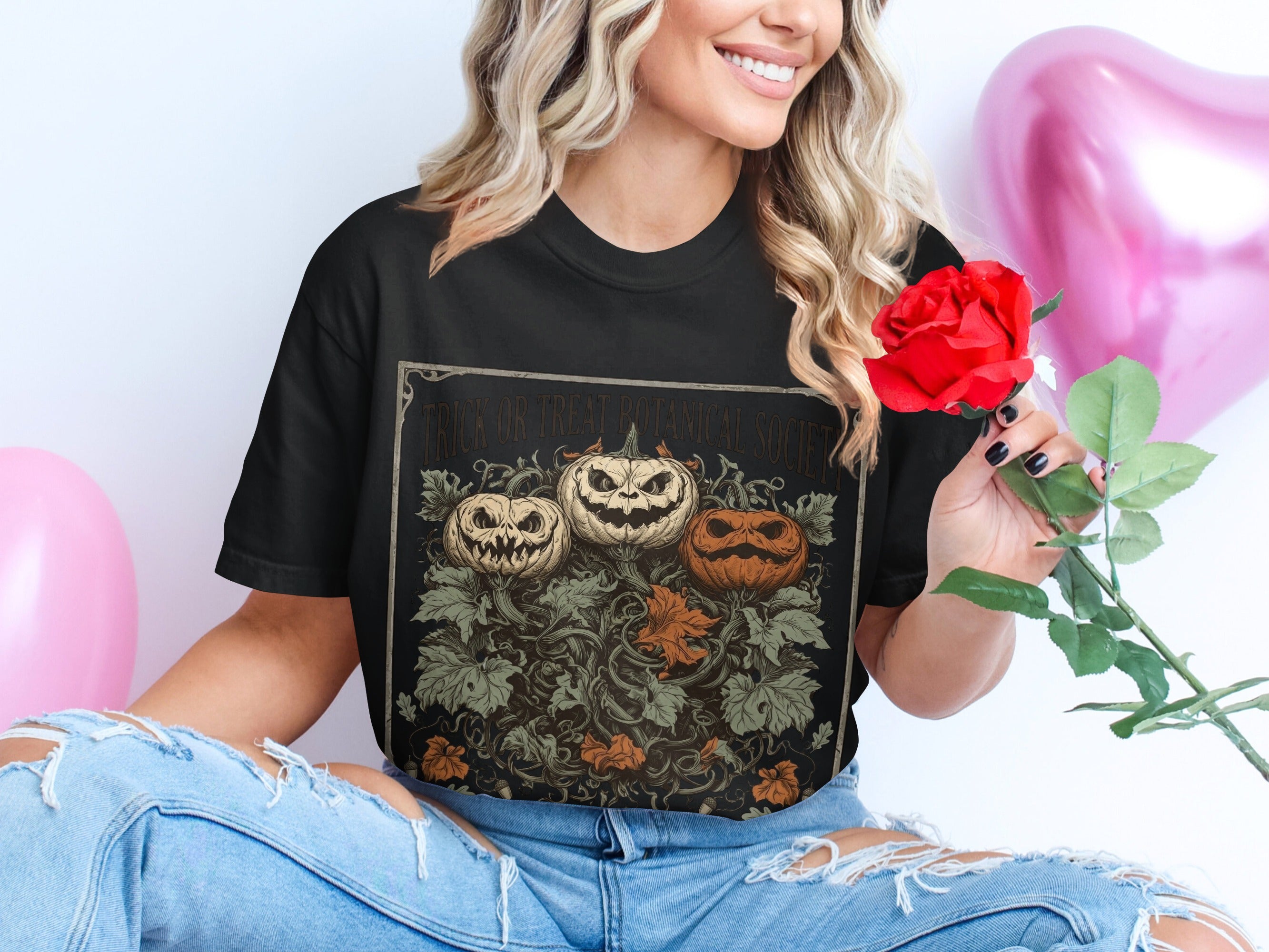 Black t-shirt with "Trick or Treat Botanical Society" and three carved pumpkins on vines.