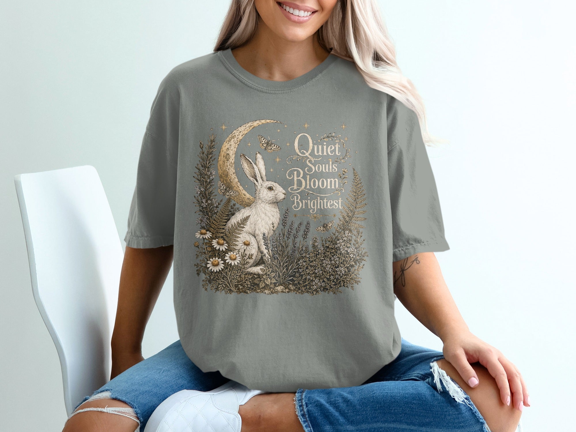 T-shirt with rabbit, moon, butterflies, and text "Quiet Souls Bloom Brightest".