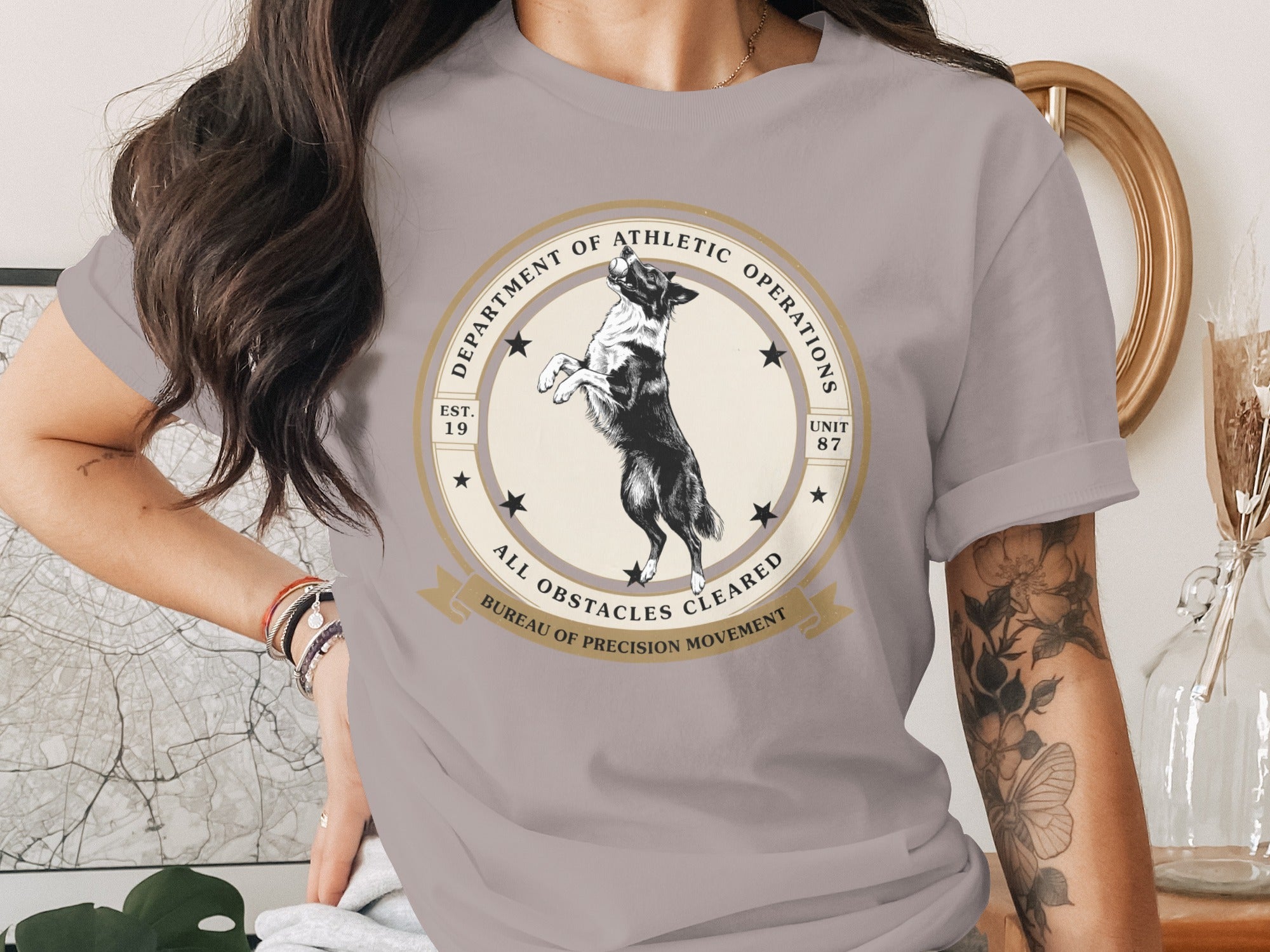 Grey t-shirt with "Department of Athletic Operations" graphic featuring a dog.