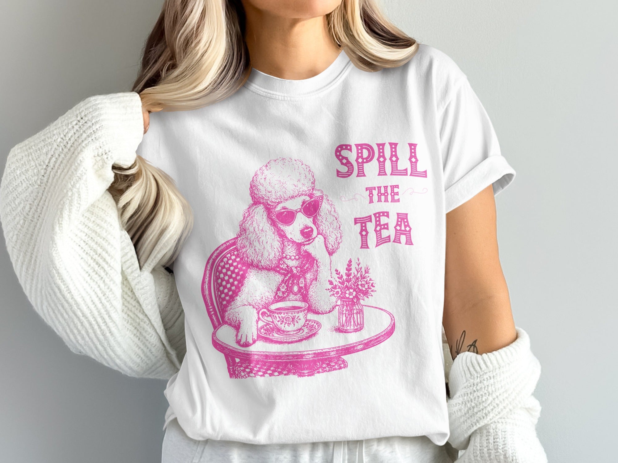 White t-shirt with pink poodle graphic saying "Spill the Tea".