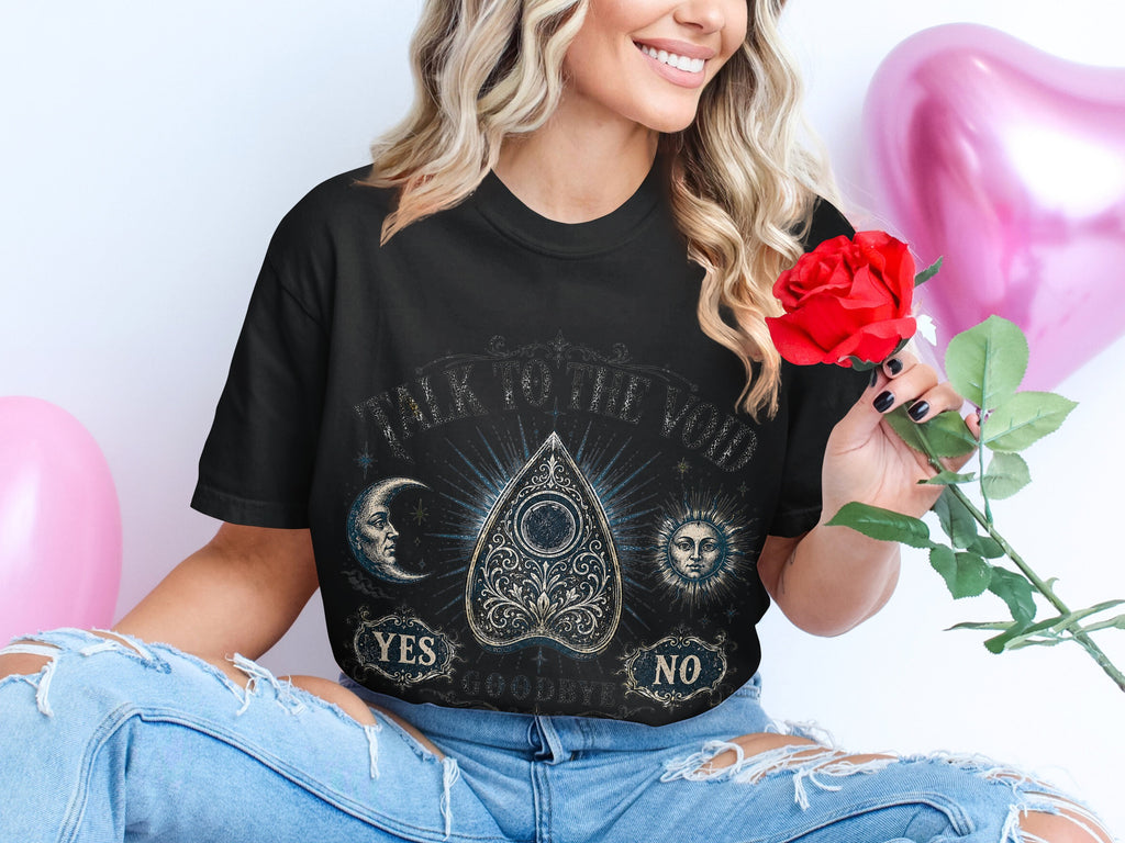 Black t-shirt with "Talk to the Void" and a ouija board design.