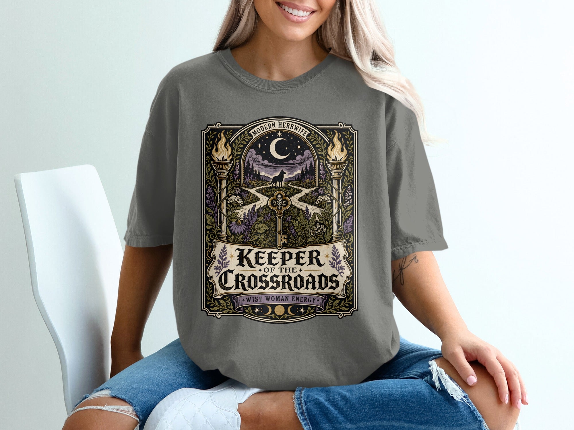 T-shirt graphic with "Keeper of the Crossroads" and "Wise Woman Energy".