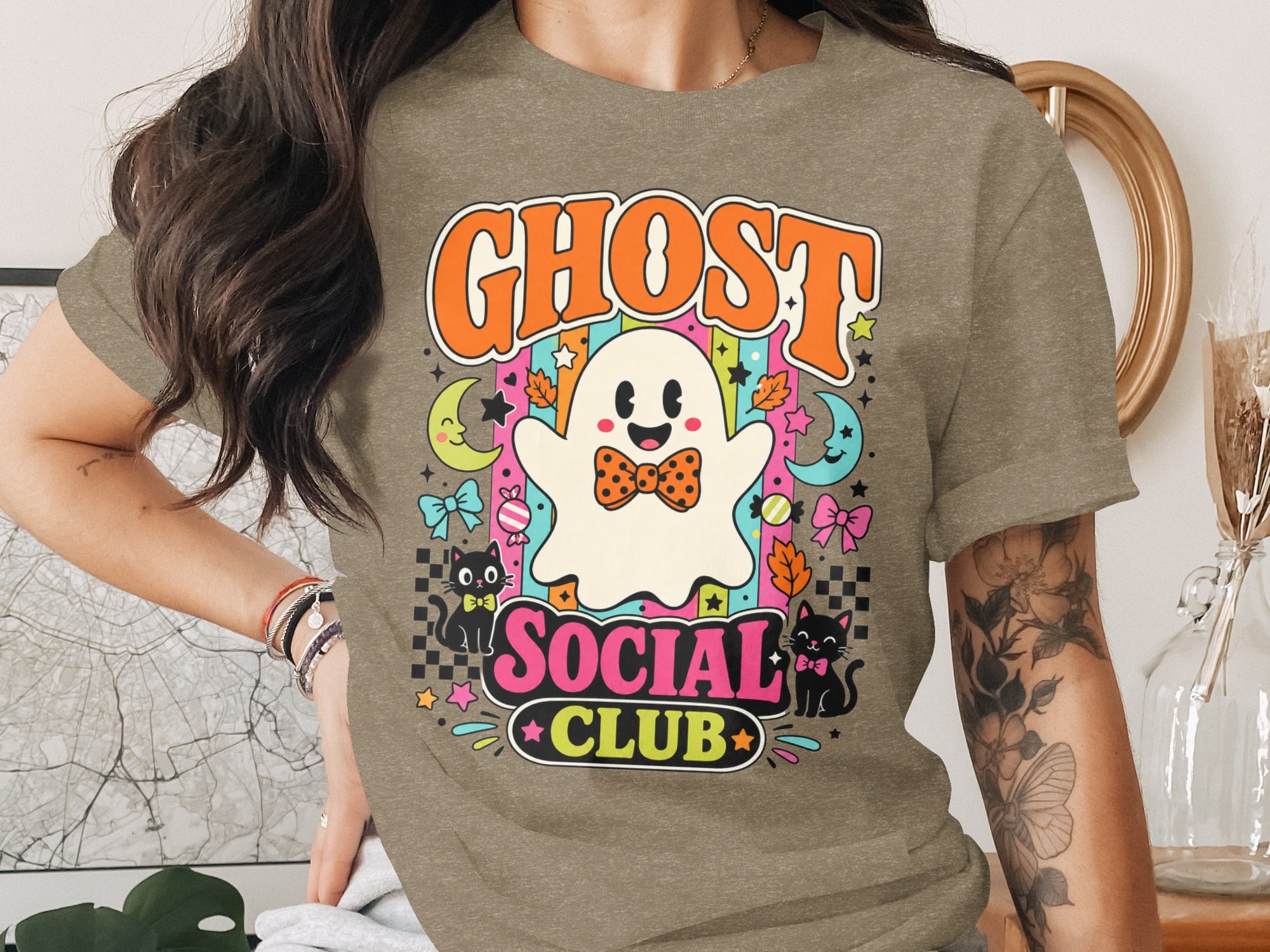 "Ghost Social Club" graphic tee with a cute ghost, black cats, moons, and stars.