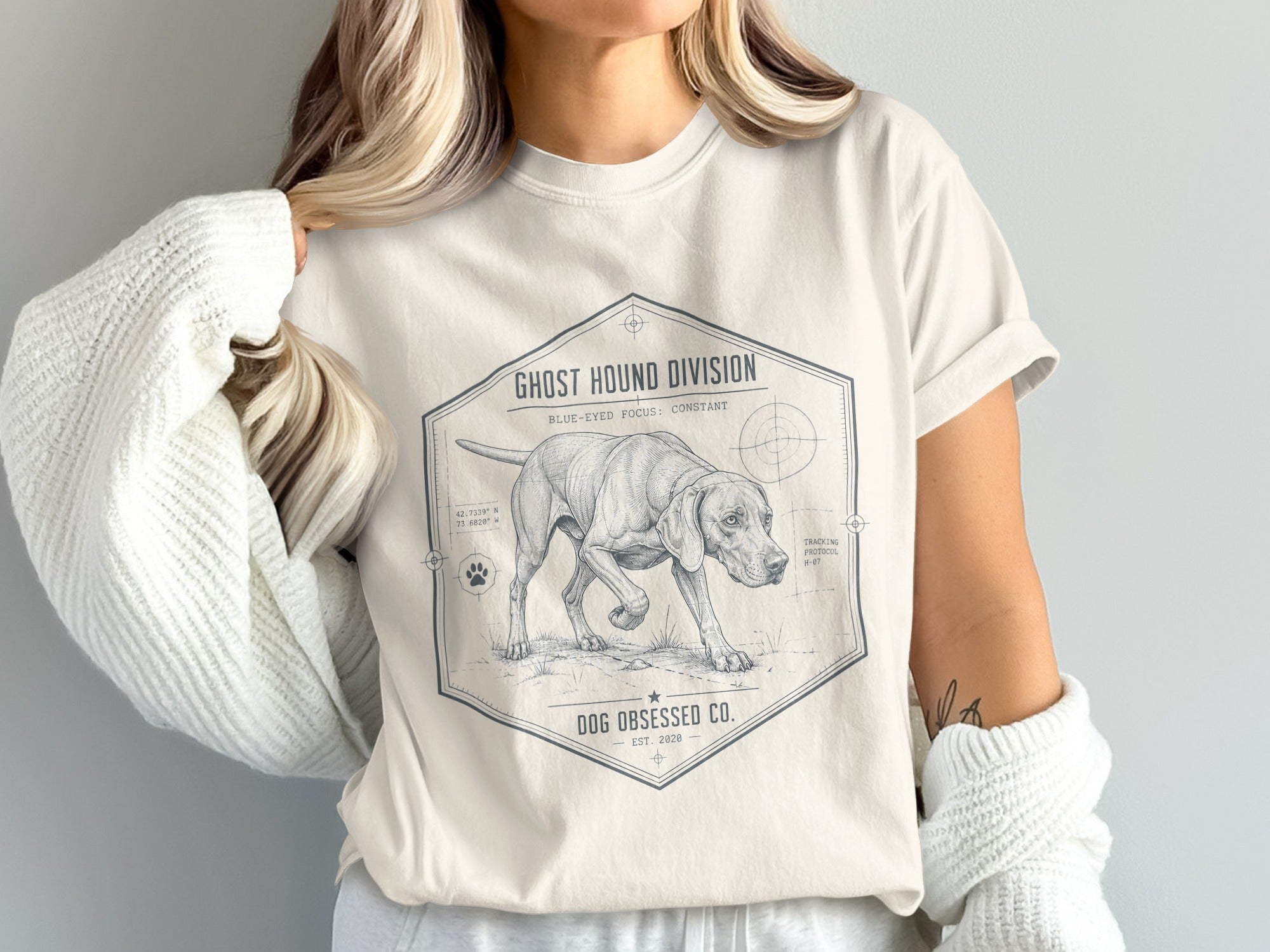 Beige t-shirt with a graphic of a hound dog, "Ghost Hound Division," and "Dog Obsessed Co."
