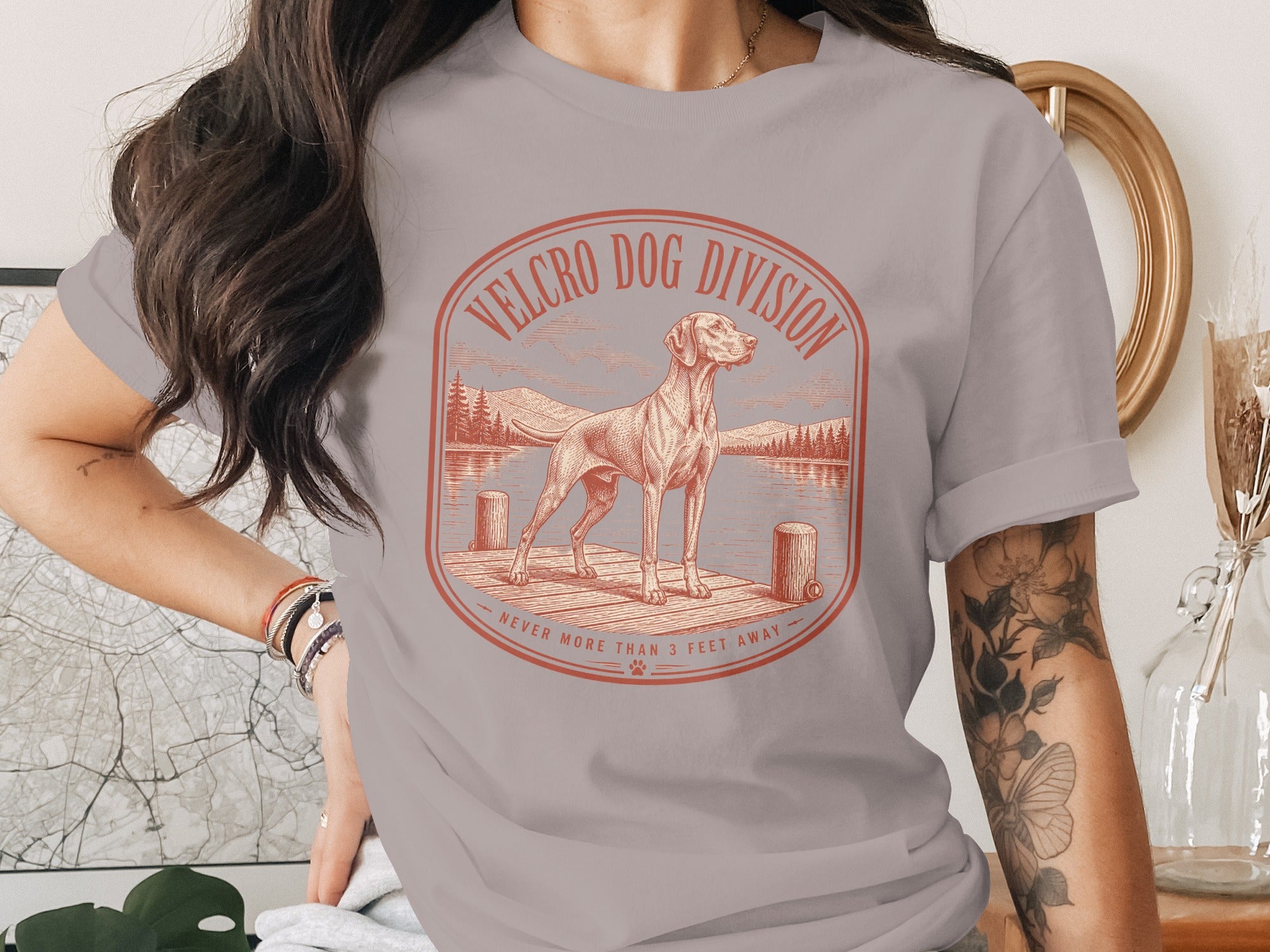 T-shirt graphic: dog on pier with "Velcro Dog Division" and "Never More Than 3 Feet Away".