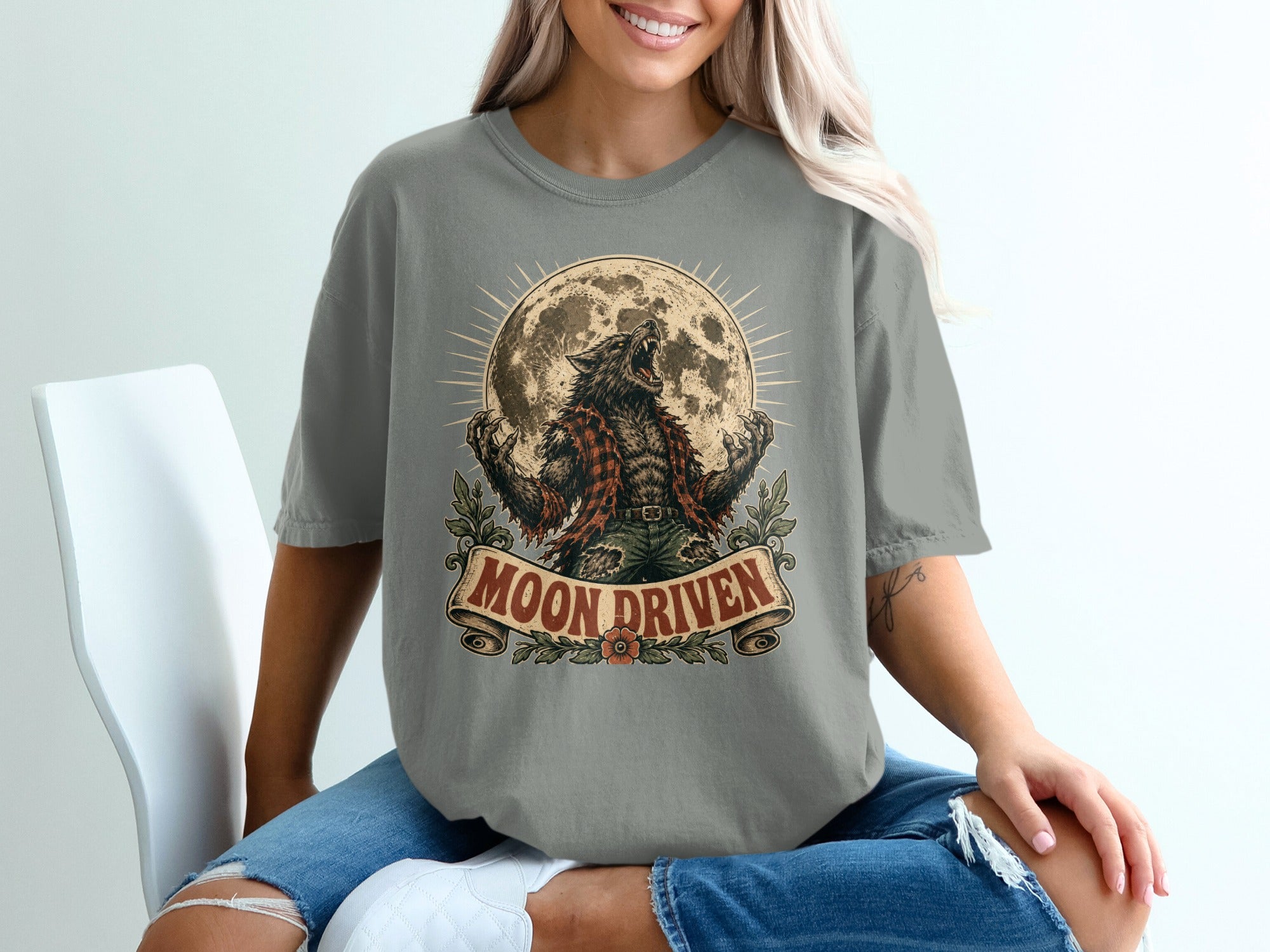 Werewolf roaring at full moon with "MOON DRIVEN" text on a shirt.