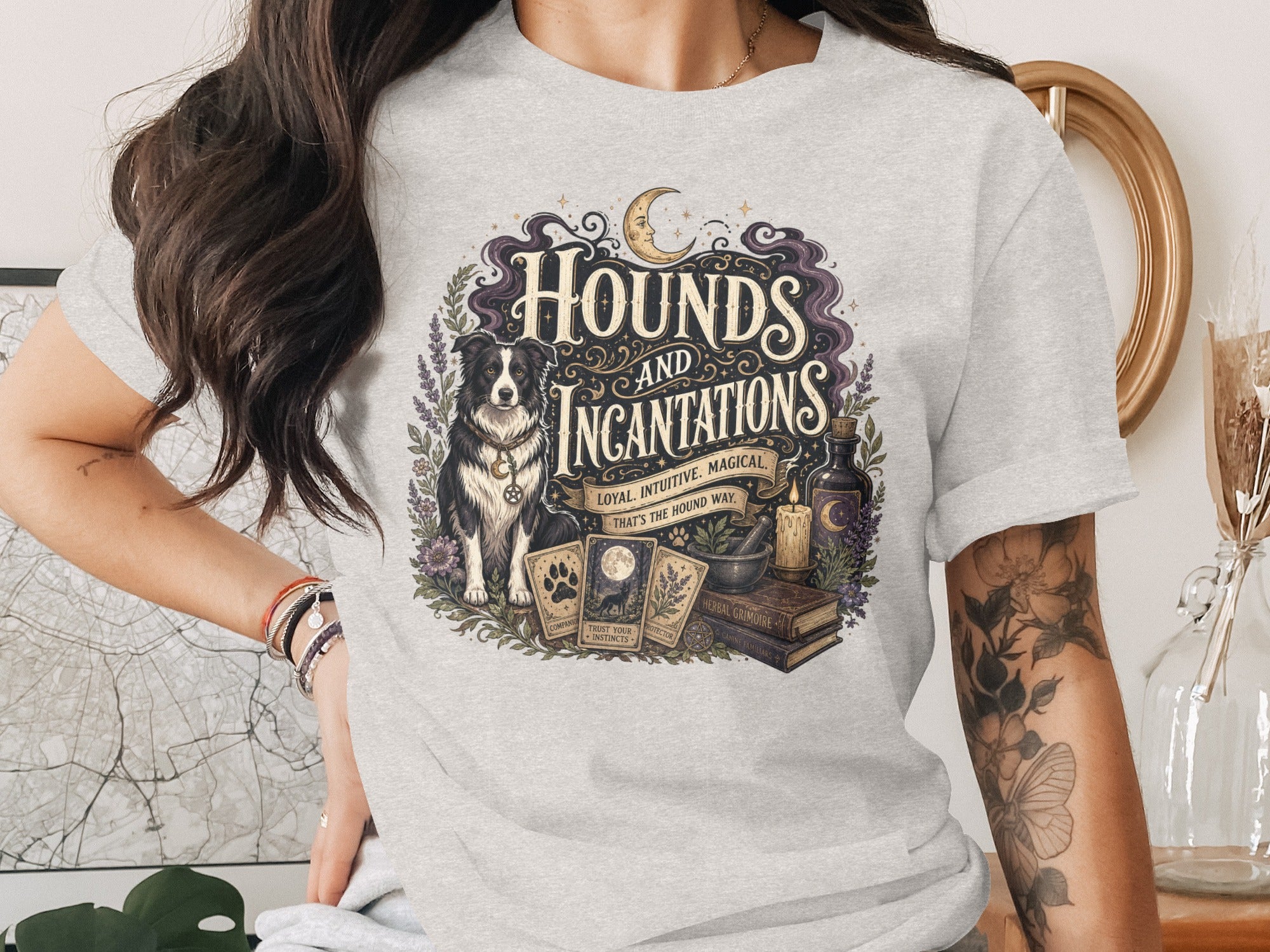 Grey t-shirt with "Hounds and Incantations" graphic featuring a dog, tarot cards, and magical items.
