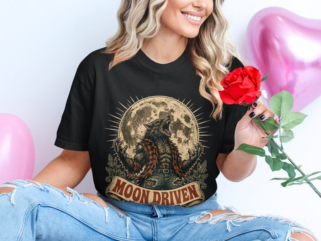 Black t-shirt with a werewolf howling at the moon design and "MOON DRIVEN" text.