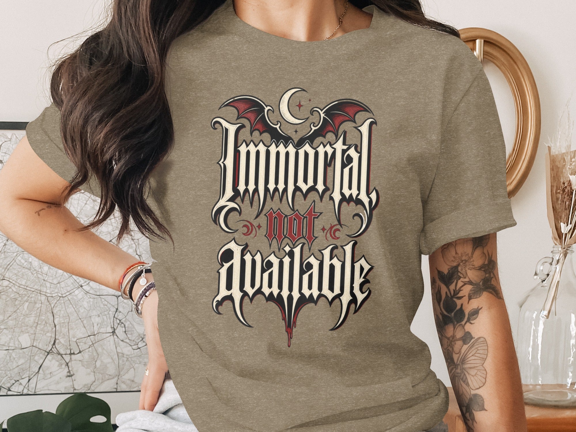 T-shirt with "Immortal not available" text and gothic bat wings design.