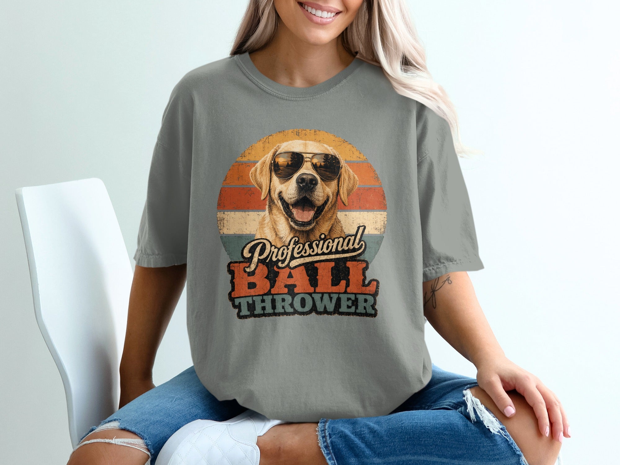 Grey t-shirt with a dog wearing sunglasses and "Professional BALL THROWER" text.