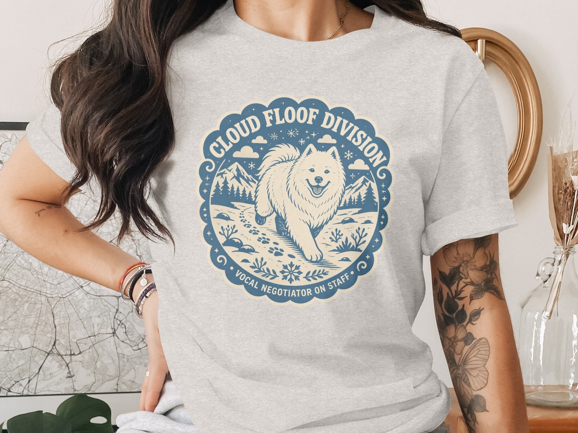 Grey t-shirt with "Cloud Floof Division Vocal Negotiator on Staff" text and a dog illustration.