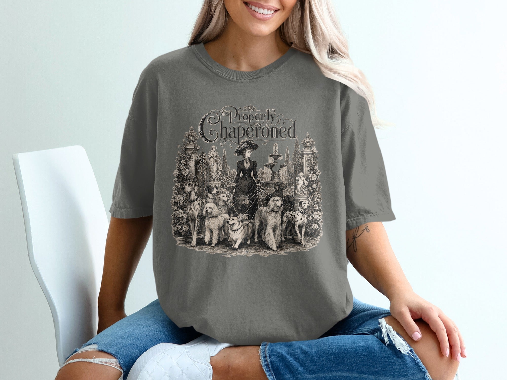 T-shirt with vintage illustration titled "Properly Chaperoned" featuring Victorian woman and dogs.