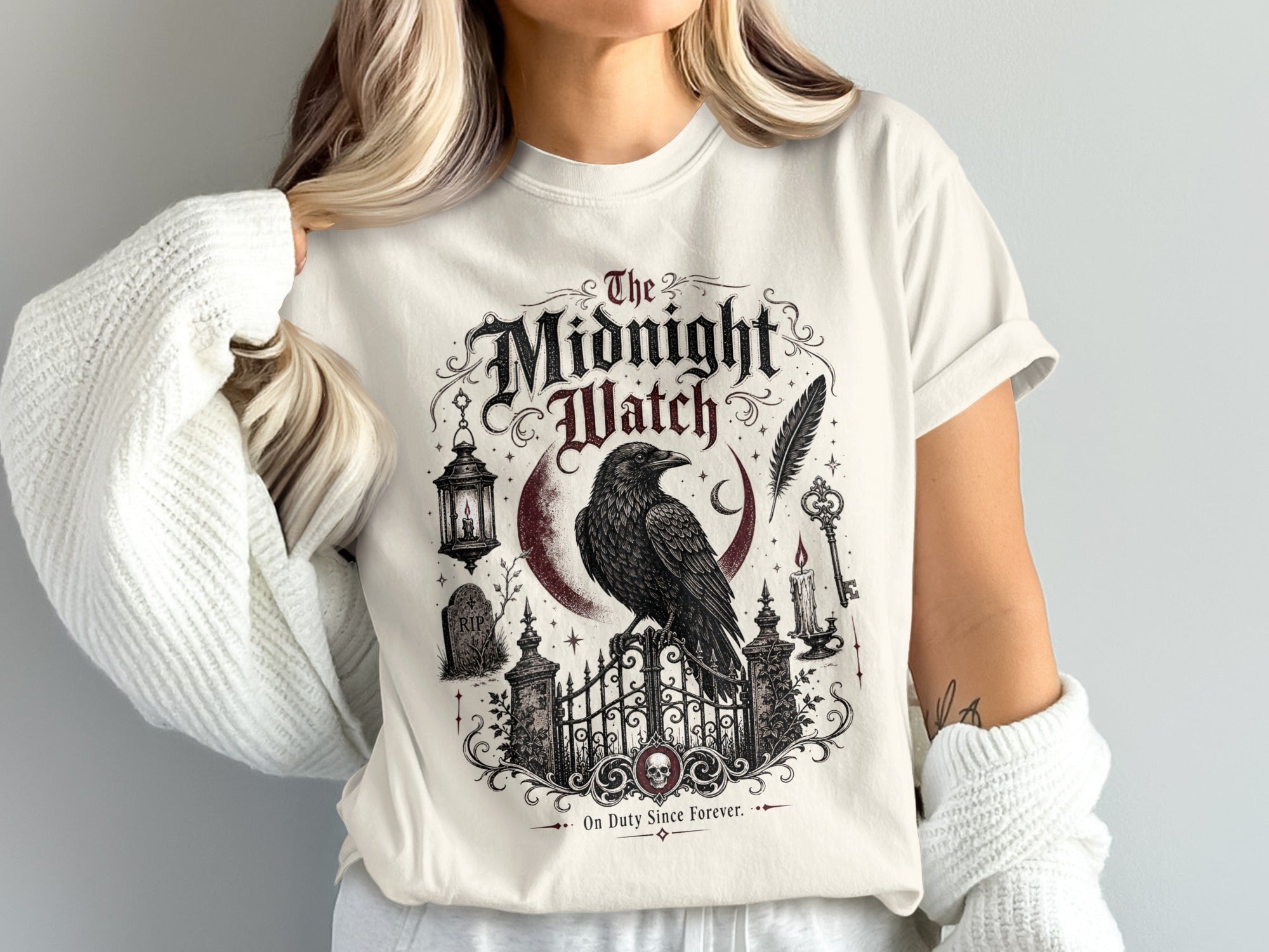 T-shirt with The Midnight Watch raven, moon, gate, and tombstone graphic.