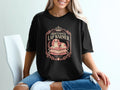 Black t-shirt with "Professional Lap Warmer" text and illustration of a dog.