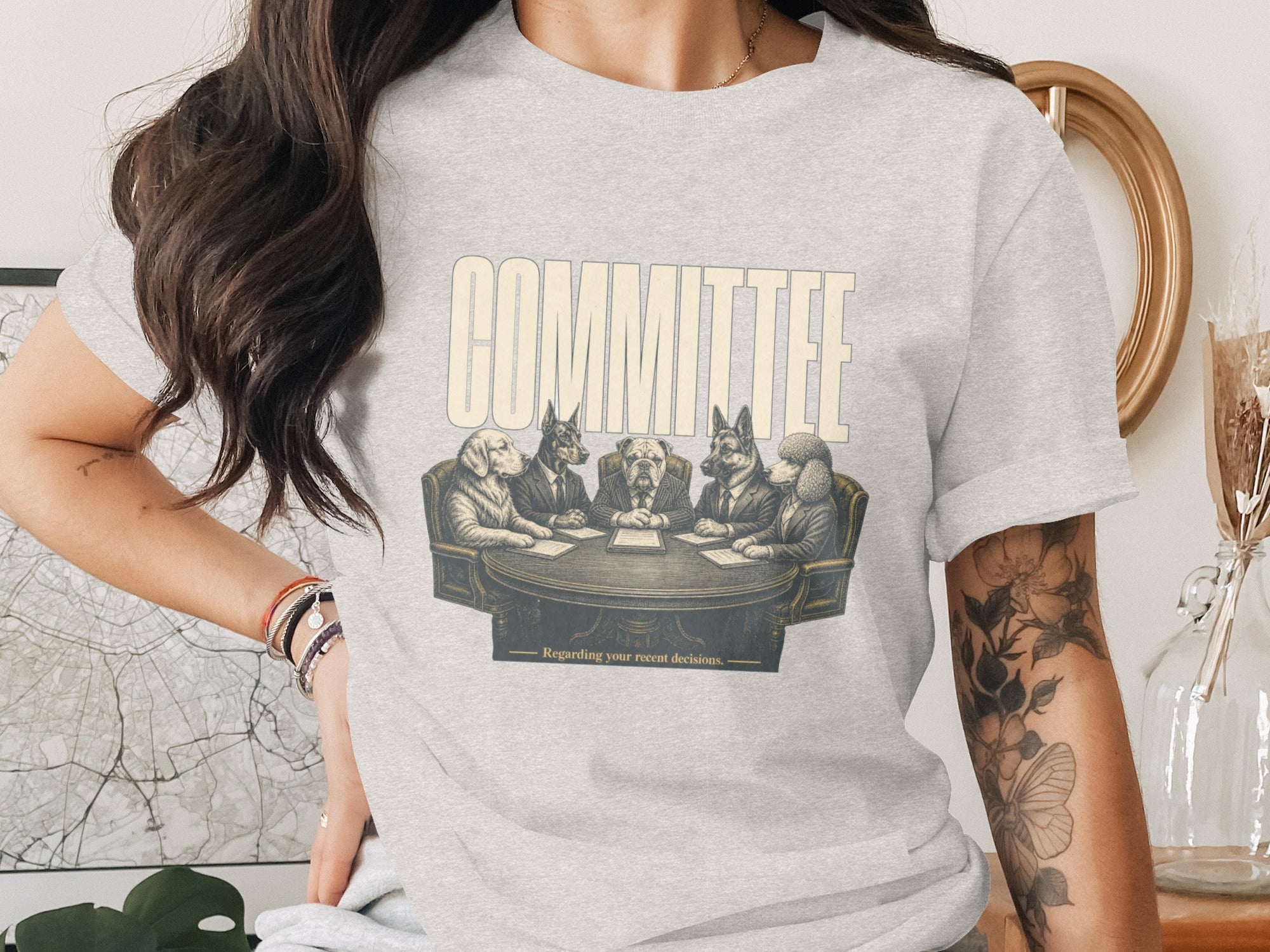 T-shirt graphic: dogs in suits at a round table with text "COMMITTEE"
