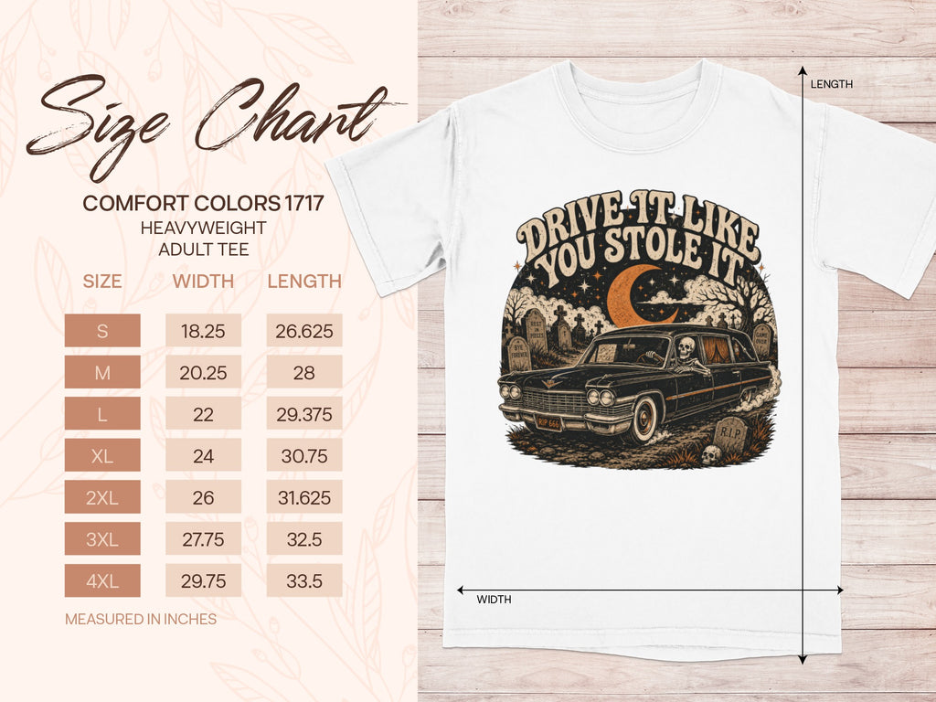 White t-shirt with a skeletal figure driving a vintage car with text "Drive It Like You Stole It."