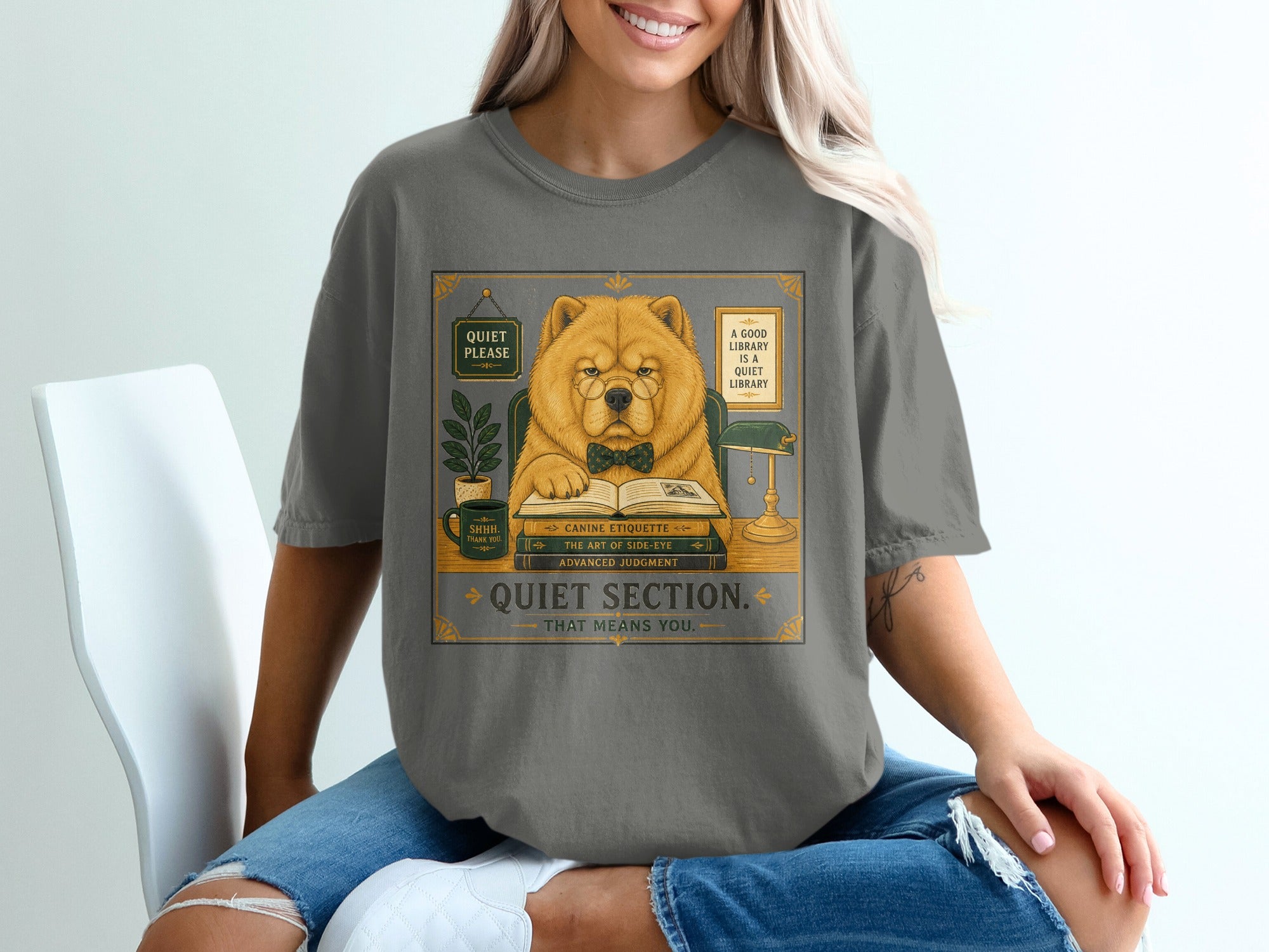 Chow Chow wearing glasses and bowtie reads books in a quiet library section.