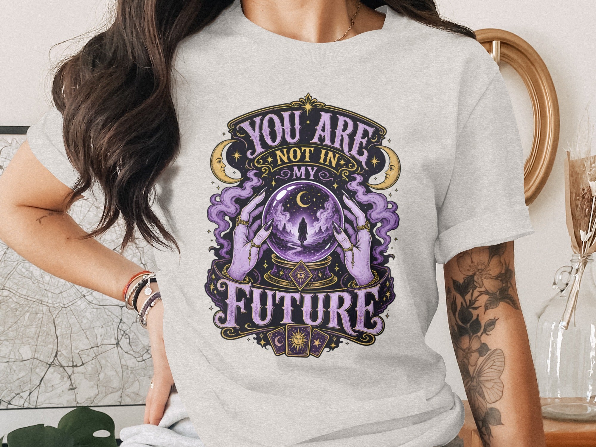 Grey t-shirt with the text "You are not in my future" and mystical imagery.