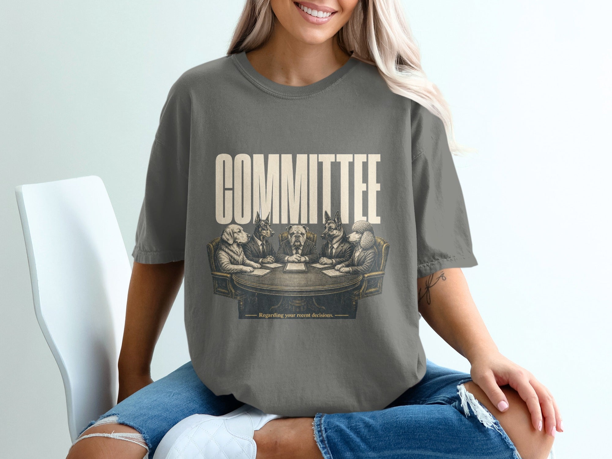 T-shirt featuring dogs in suits around a table with the text COMMITTEE.