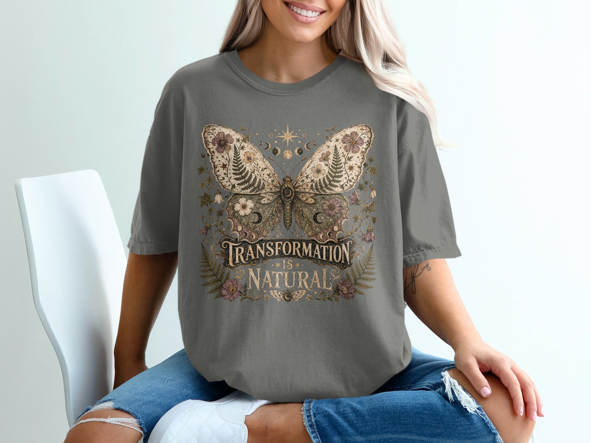 T-shirt with "Transformation Is Natural" text and a detailed butterfly graphic.
