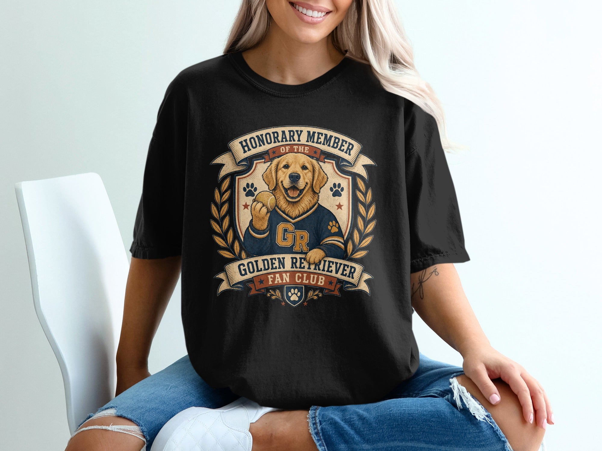 Black t-shirt with golden retriever holding tennis ball, "Honorary Member Golden Retriever Fan Club" text.