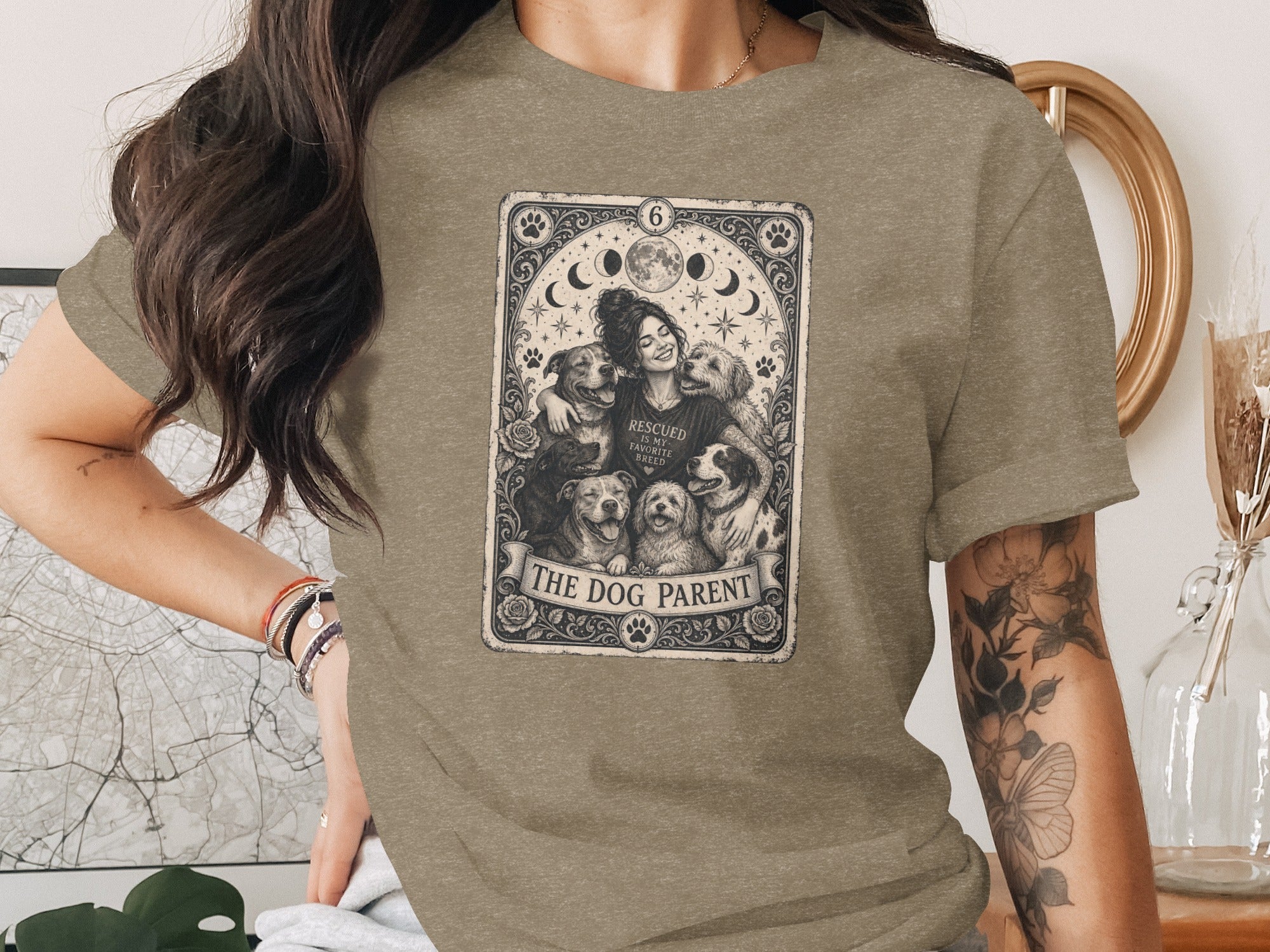 T-shirt featuring a vintage-style tarot card design of dogs and "The Dog Parent" text.