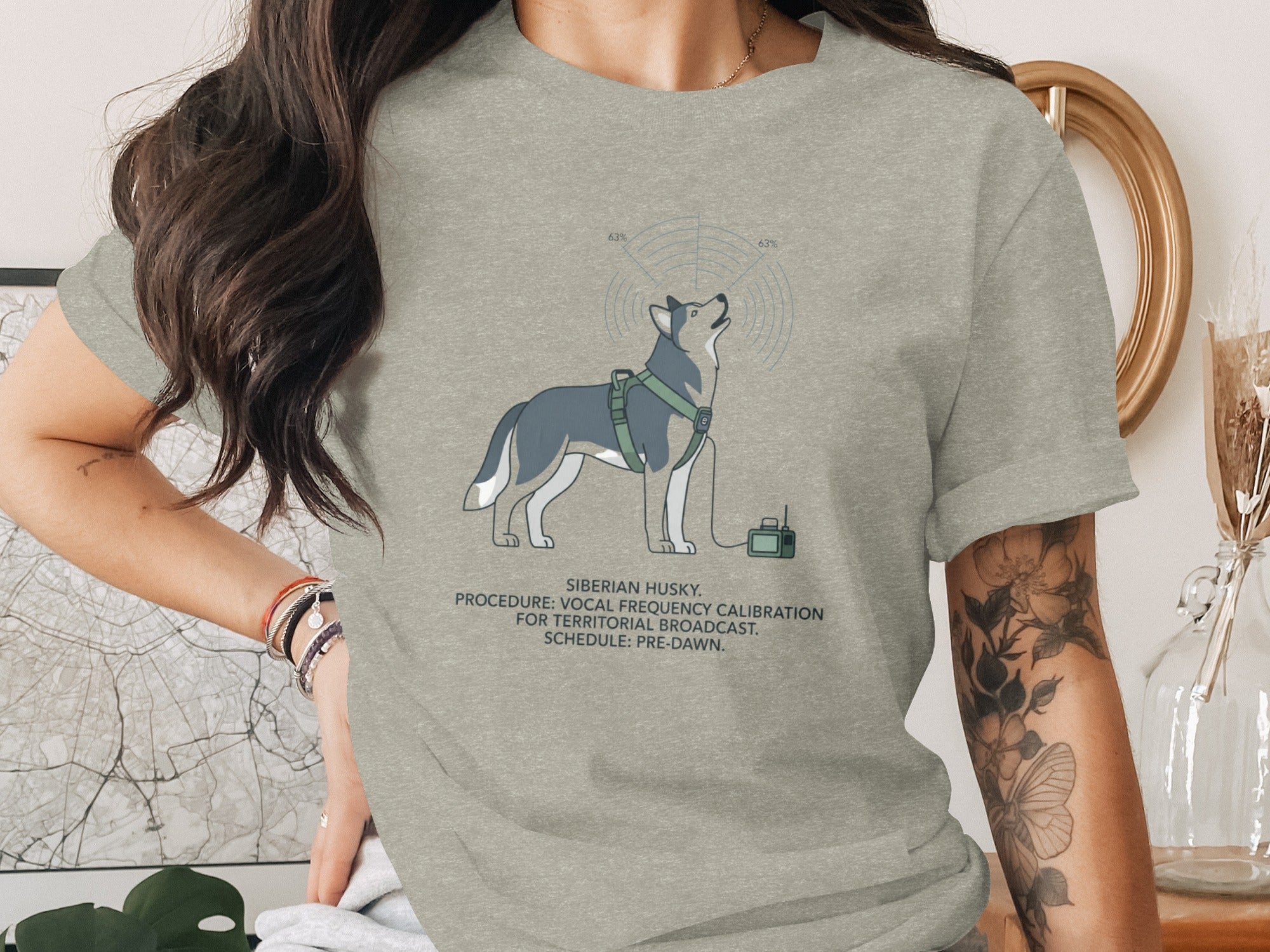 Siberian husky graphic with text about vocal frequency calibration on a grey t-shirt.