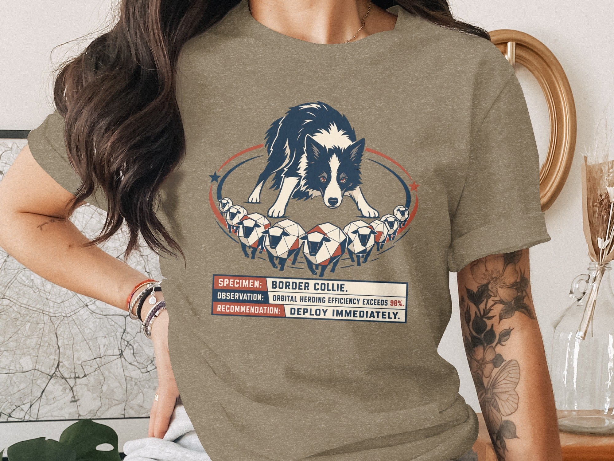 Border collie art with text "Deploy Immediately" on a tan t-shirt.