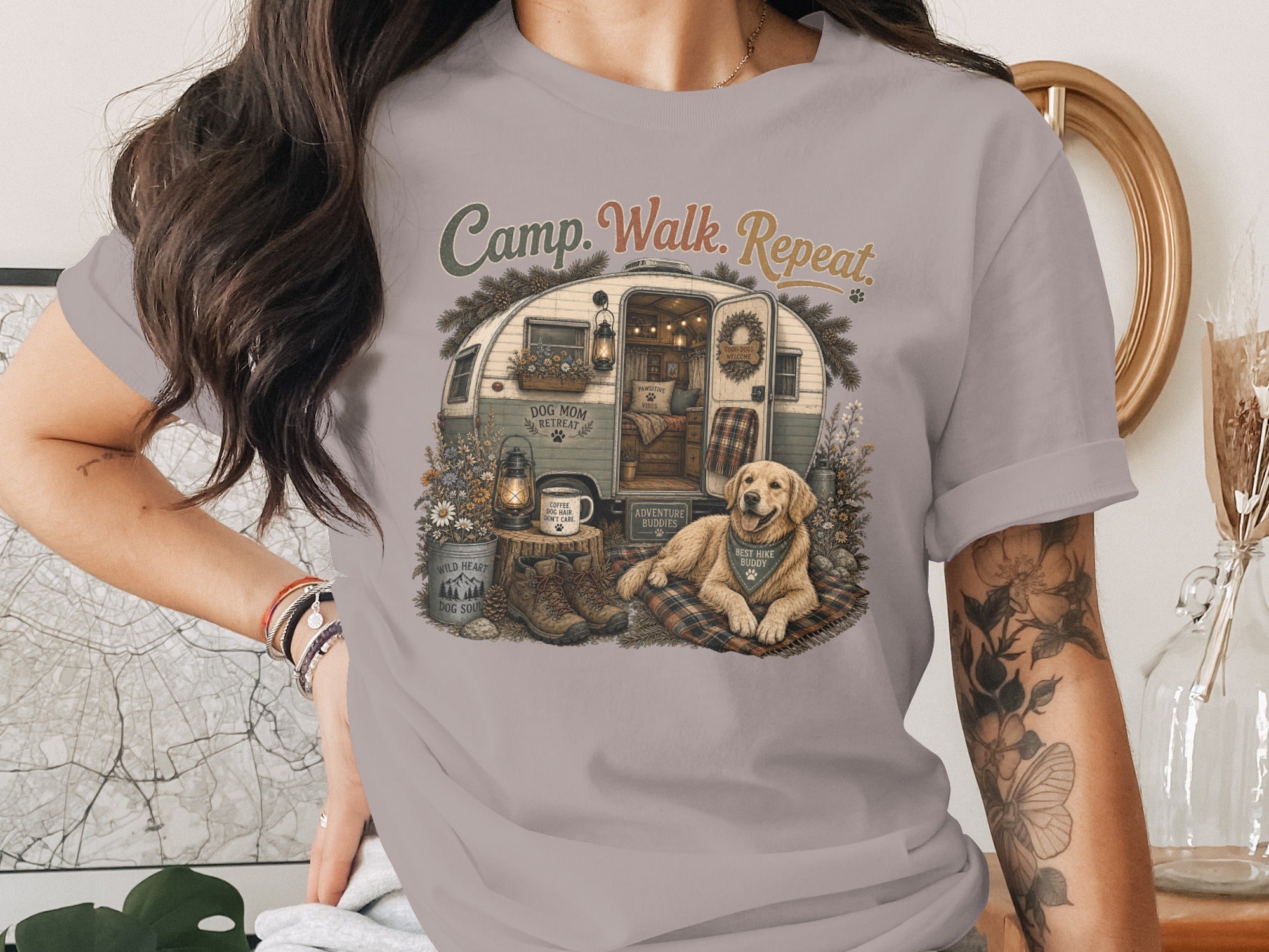 Graphic featuring text "Camp. Walk. Repeat." with a dog, camper, and camping gear.