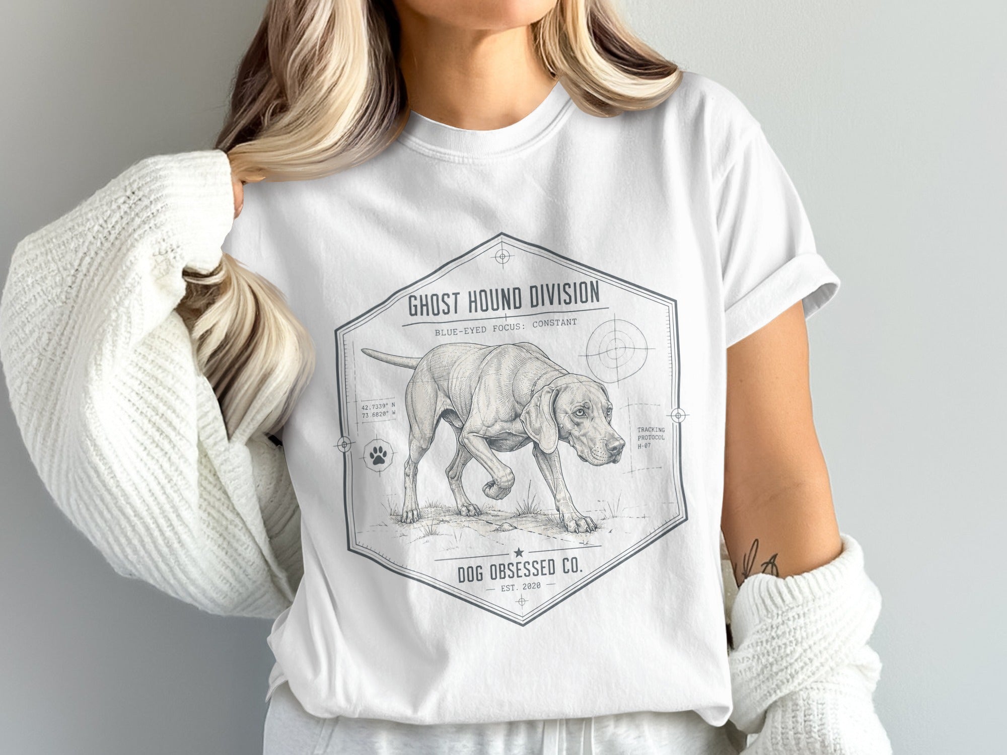 White t-shirt featuring "Ghost Hound Division" logo with dog and tracking schematics.