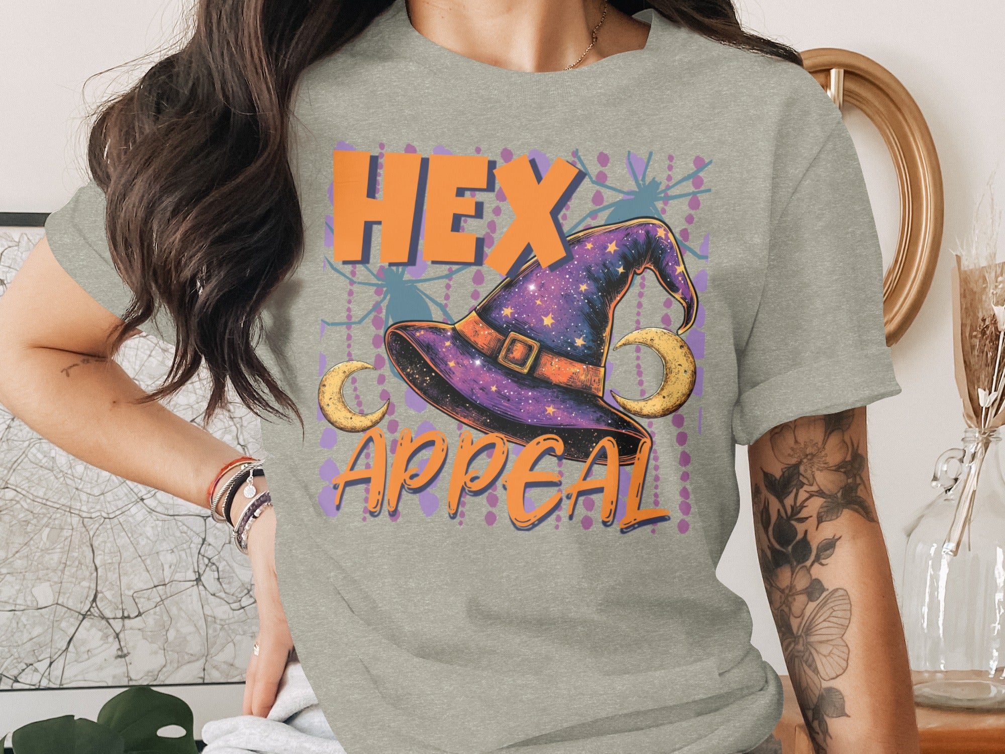 Witch hat with crescent moons and text "HEX APPEAL".