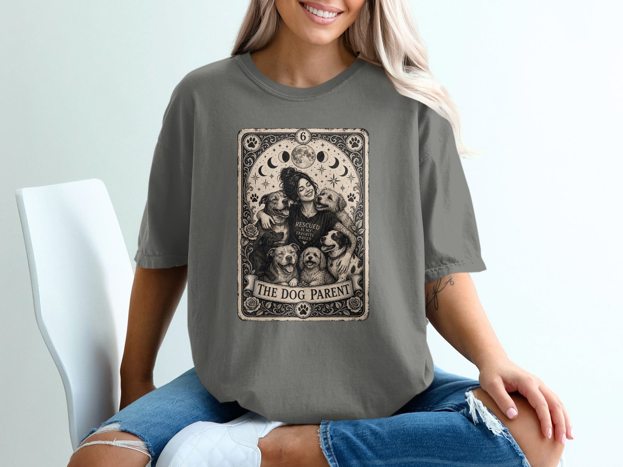 T-shirt with a tarot-style graphic featuring a woman smiling with multiple dogs and text.