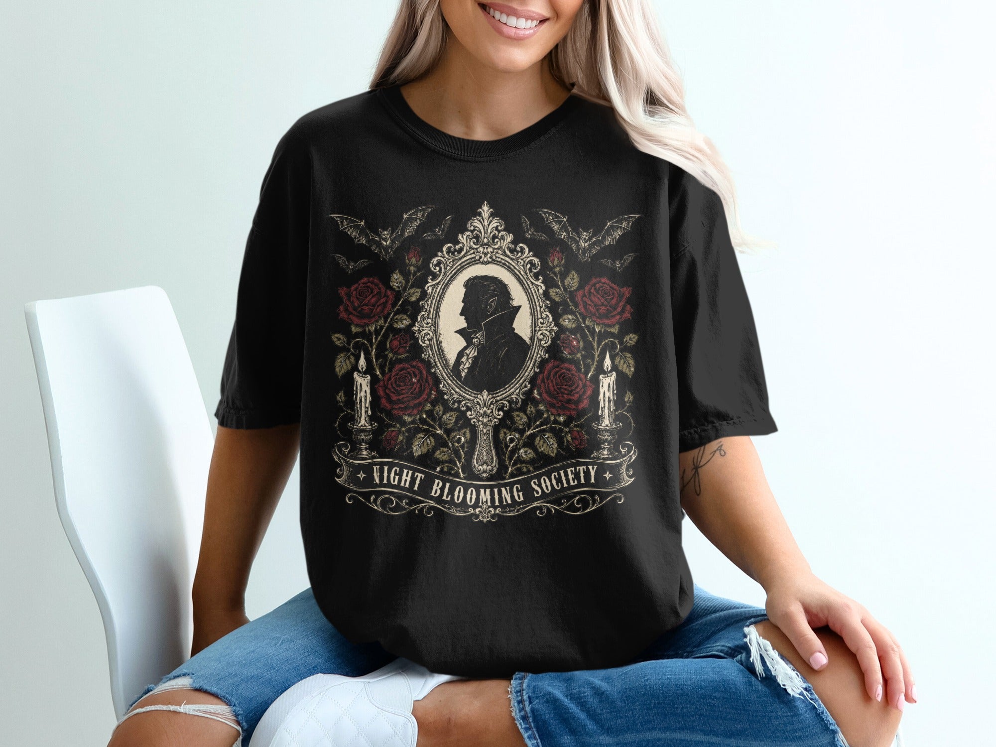 Black t-shirt with gothic design featuring a cameo, roses, bats, and candles.