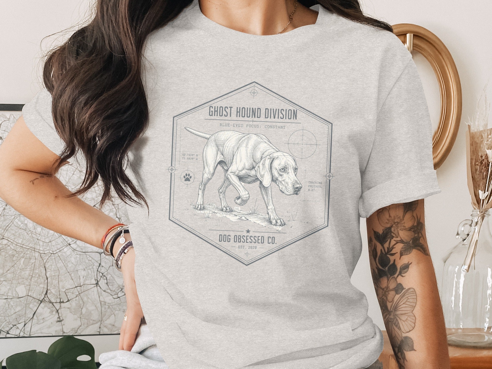 Light gray t-shirt with a detailed sketch of a pointer dog, "Ghost Hound Division", and coordinates.