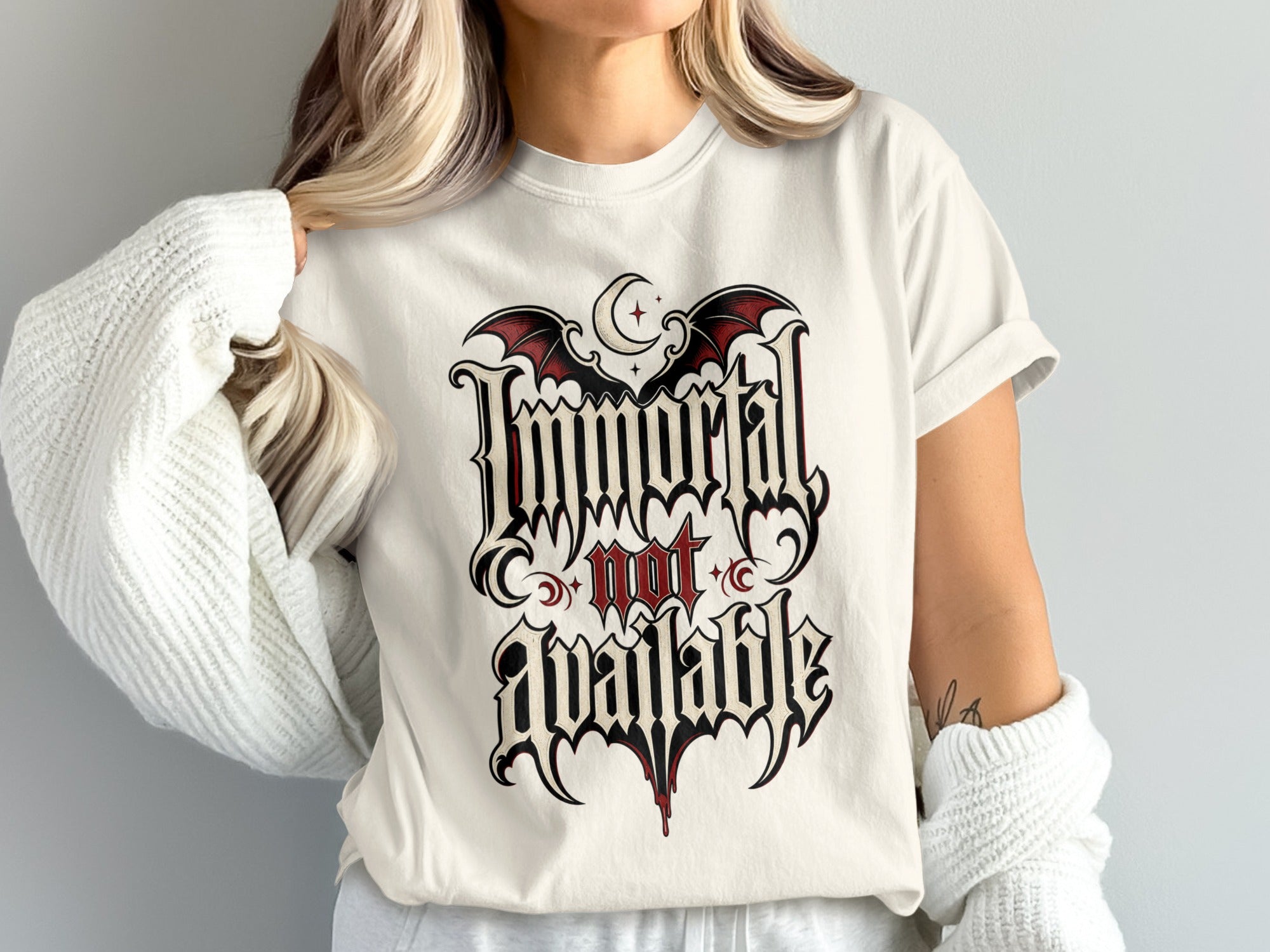 Cream t-shirt with gothic font design reading "Immortal not Available" with bats.