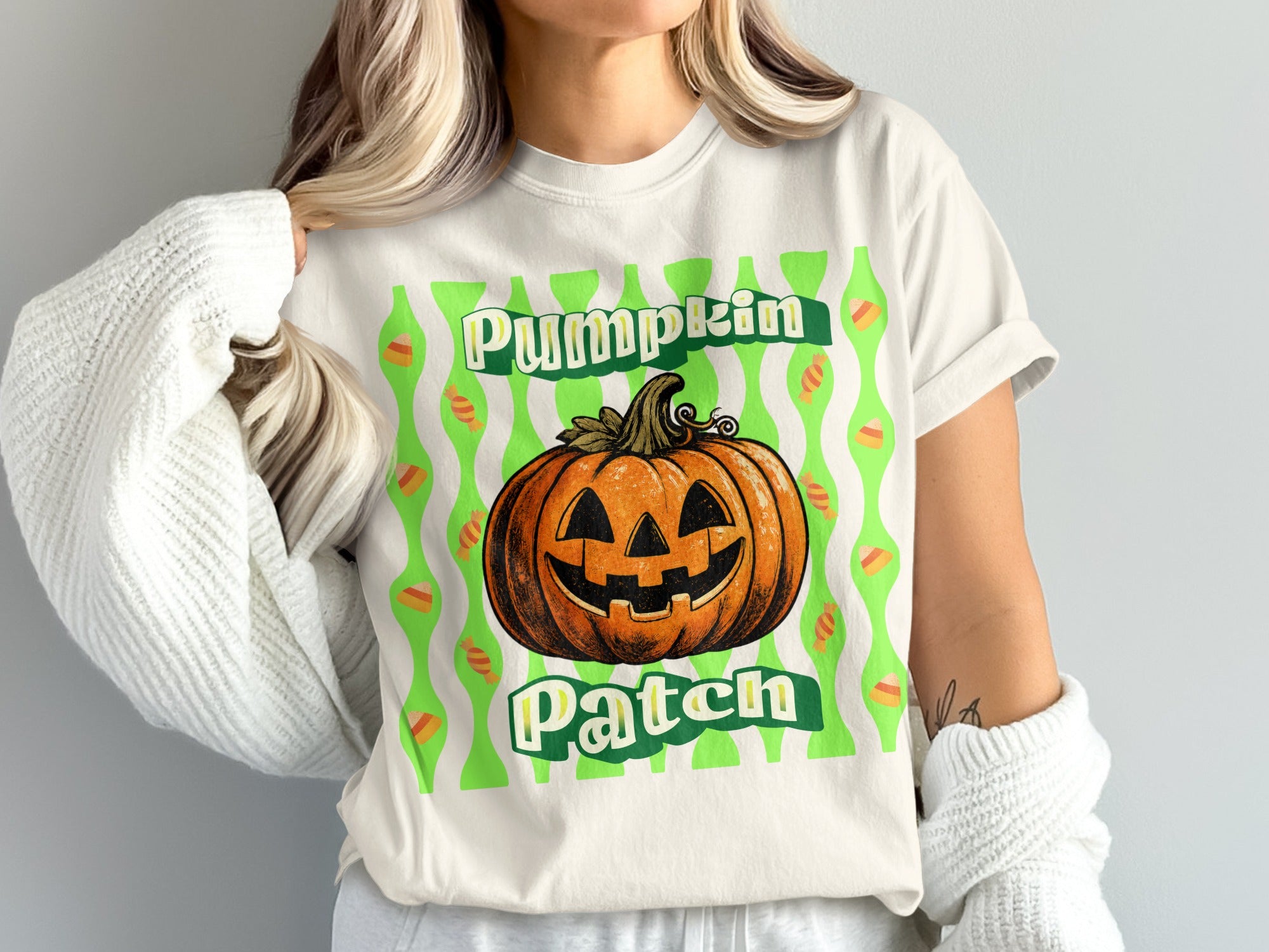 White t-shirt with a jack-o'-lantern and "Pumpkin Patch" text.